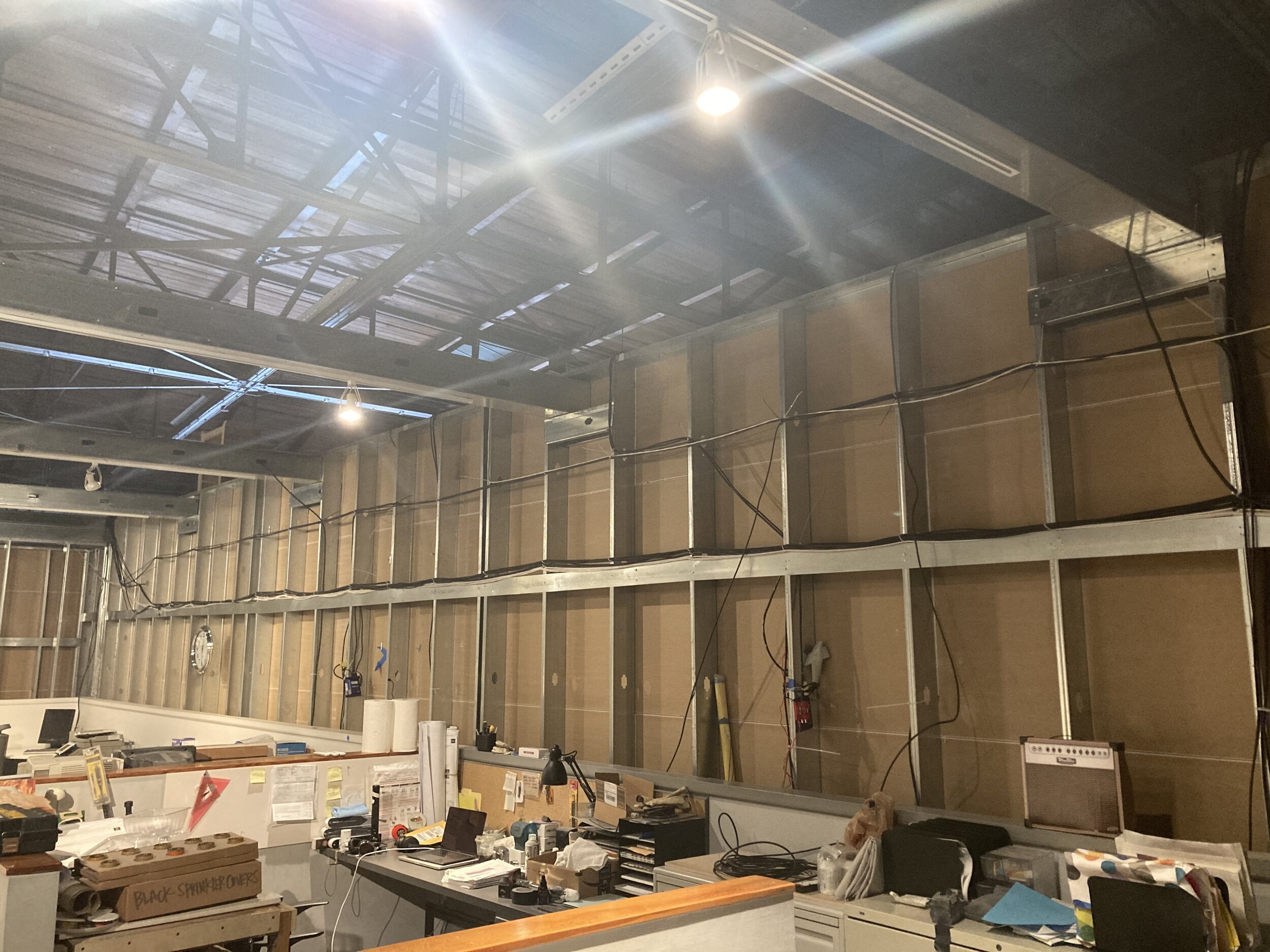 Pictured here are Brightsigns running media for monitors mounted into facade seen below.
Also pictured here are cables running out into the rest of the temporary walls of the museum and out into the 40,000 square foot warehouse space
