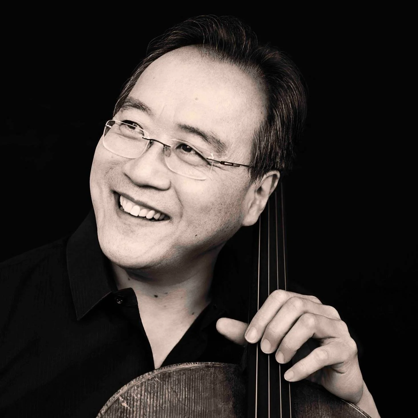 Yo-Yo Ma smiling with a cello
