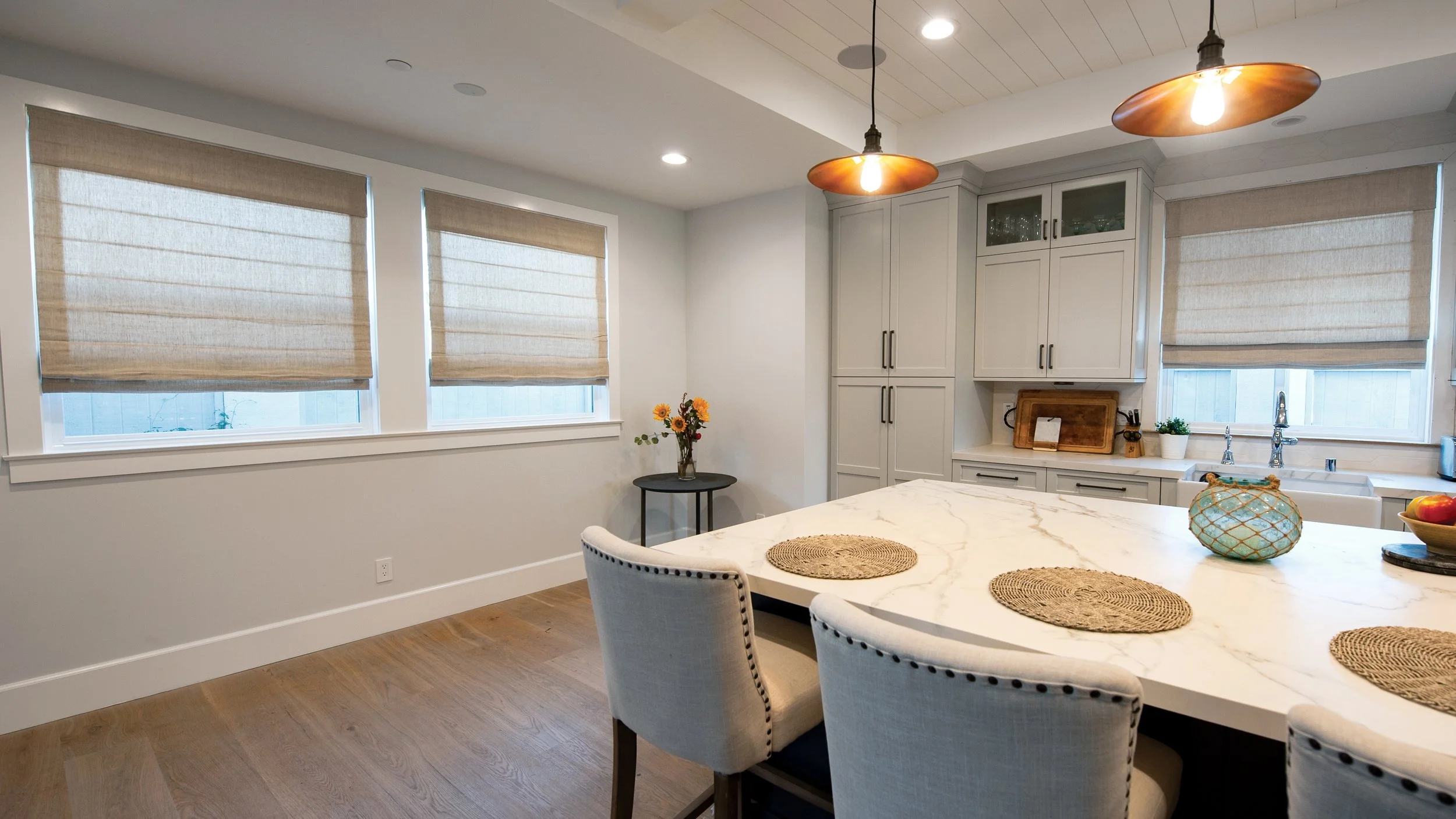 Roman Shades, Natural tones in living room and kitchen spaces