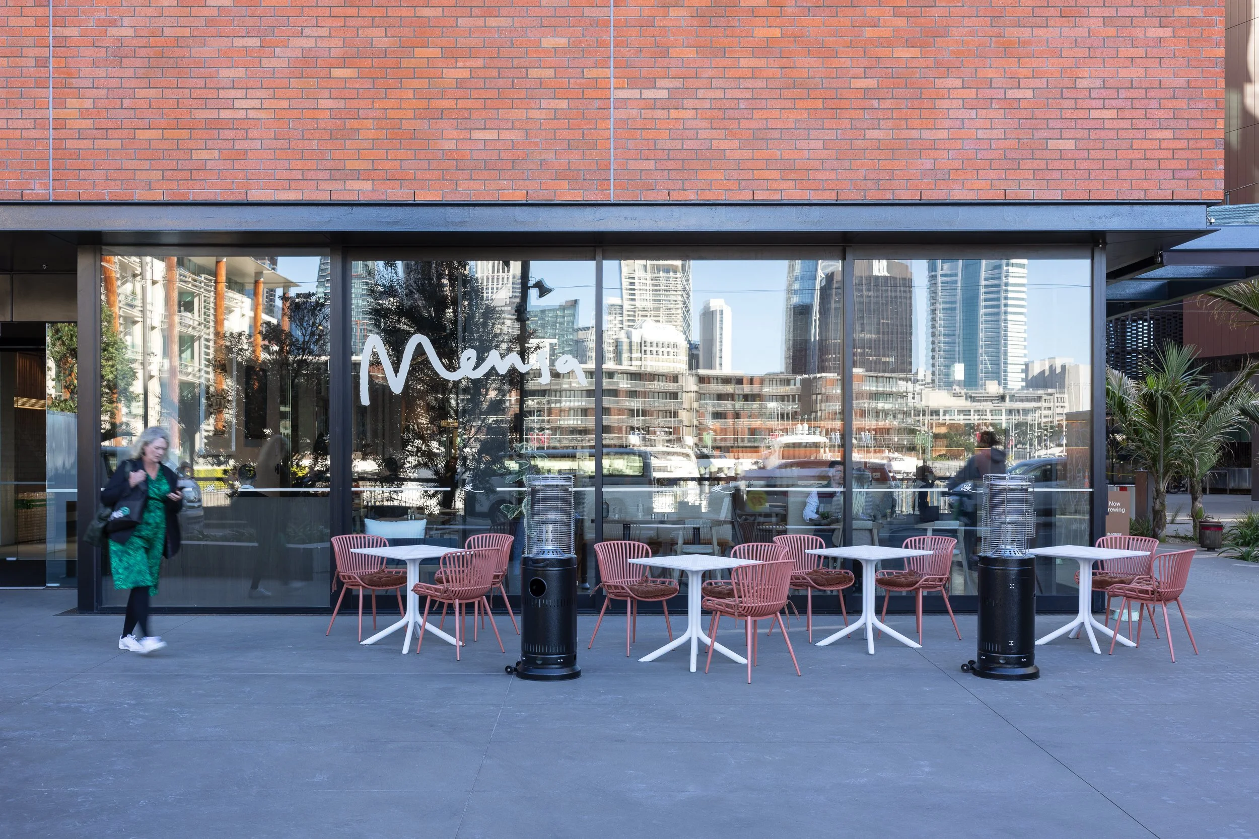 Cafe exterior with city view window reflections