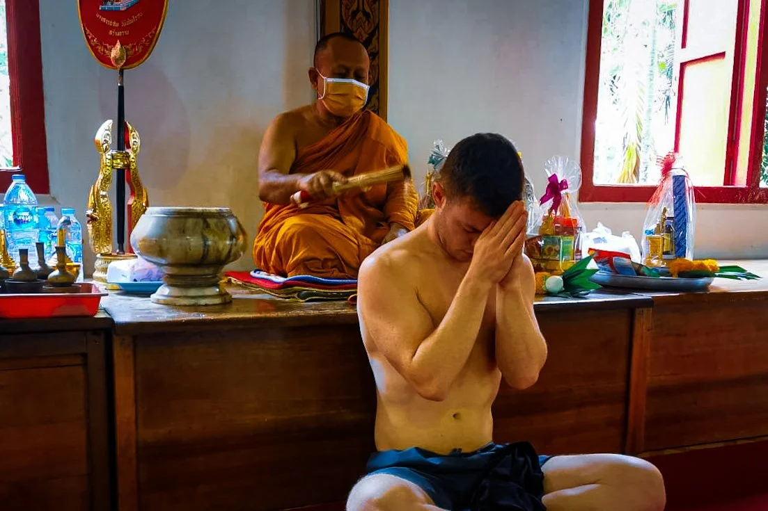 Monk blessing a Sak Yant tattoo in Wat Chalong