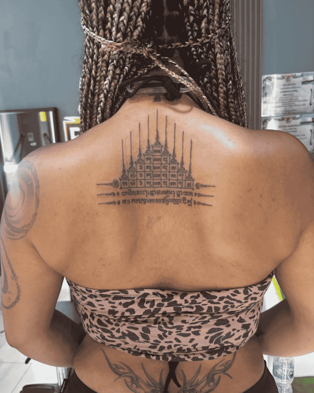 Traditional hand-poked Sak Yant Phuket featuring Gao Yord (9 Peaks) back tattoo