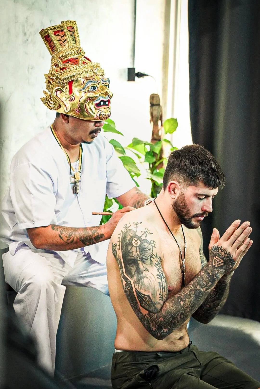 Ajarn Dam giving a customer a sak yant blessing in phuket