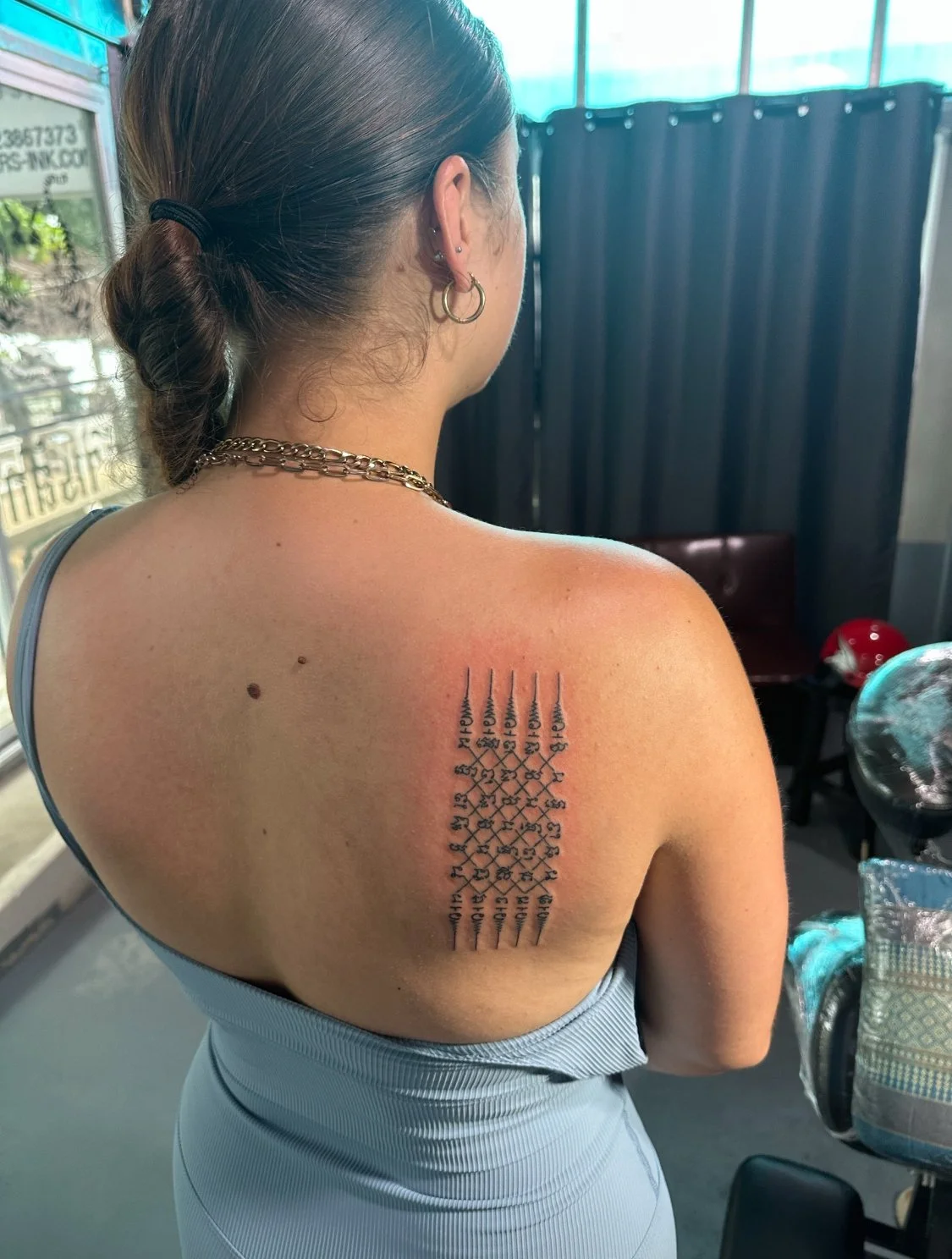 Lady with a chat phet sak yant from fighters ink Phuket