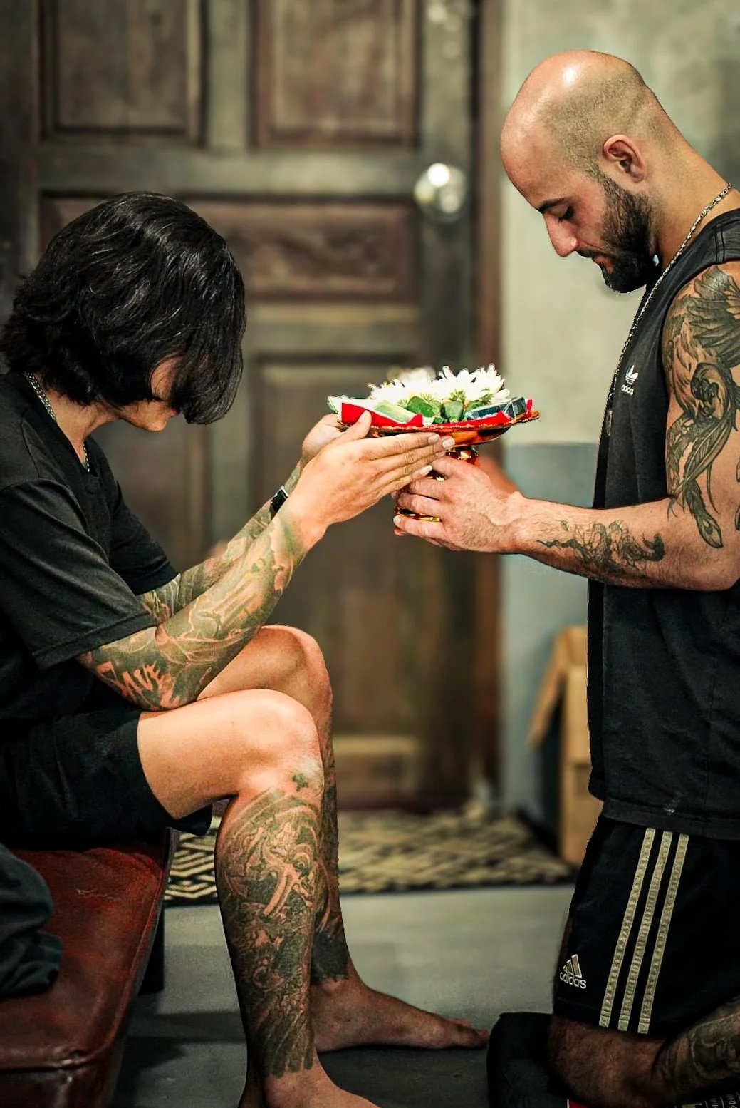 Ajarn Ben giving a sak yant blessing at fighters ink in phuket