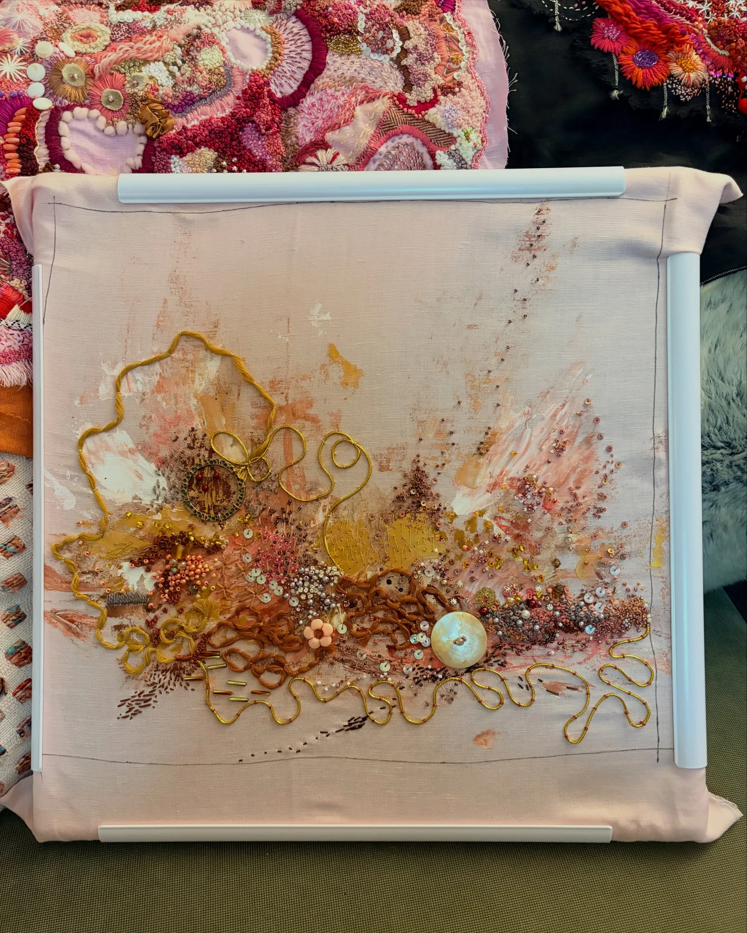 Painted linen became the starting point for this piece; an exploration of texture, stitch, and embellishment. Layer by layer, beads, thread, sequins, and found treasures emerged from the surface, creating a landscape that feels both imagined and reme