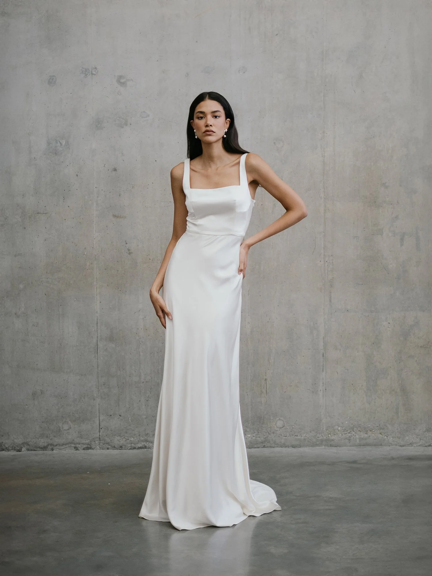 bias cut wedding dress Dress: Gossamer by Alexandra Grecco Fabric: Silk crepe satin Cut: A bias-cut, high-neck silhouette with vintage seamlines Bride: Says less, but makes it legendary The Carolyn Silk Slip dress is a dream to wear and the perfect pairing with our long Elegant Wells Cowl Neck Wedding
