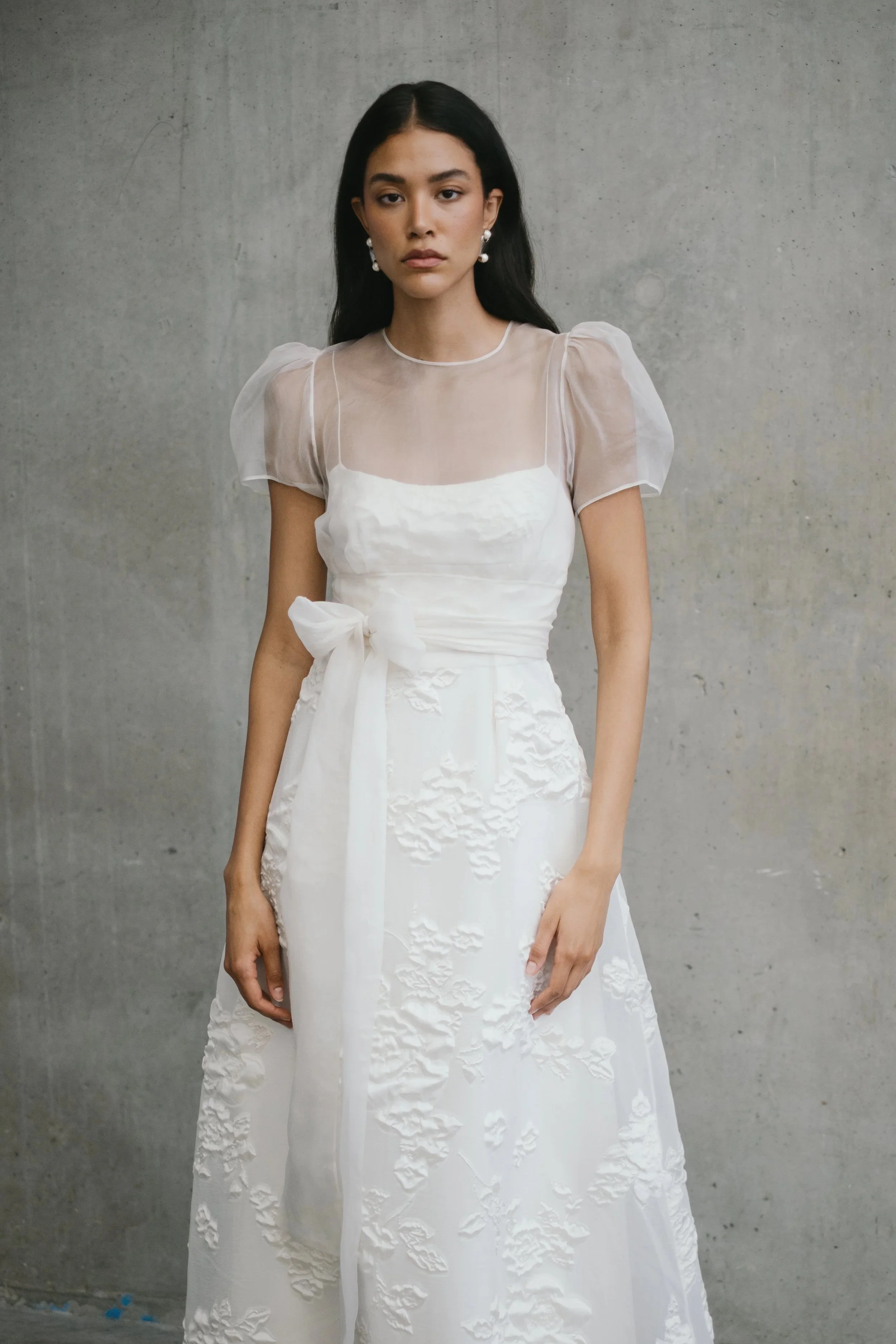 bridal model wearing puff sleeve sheer top