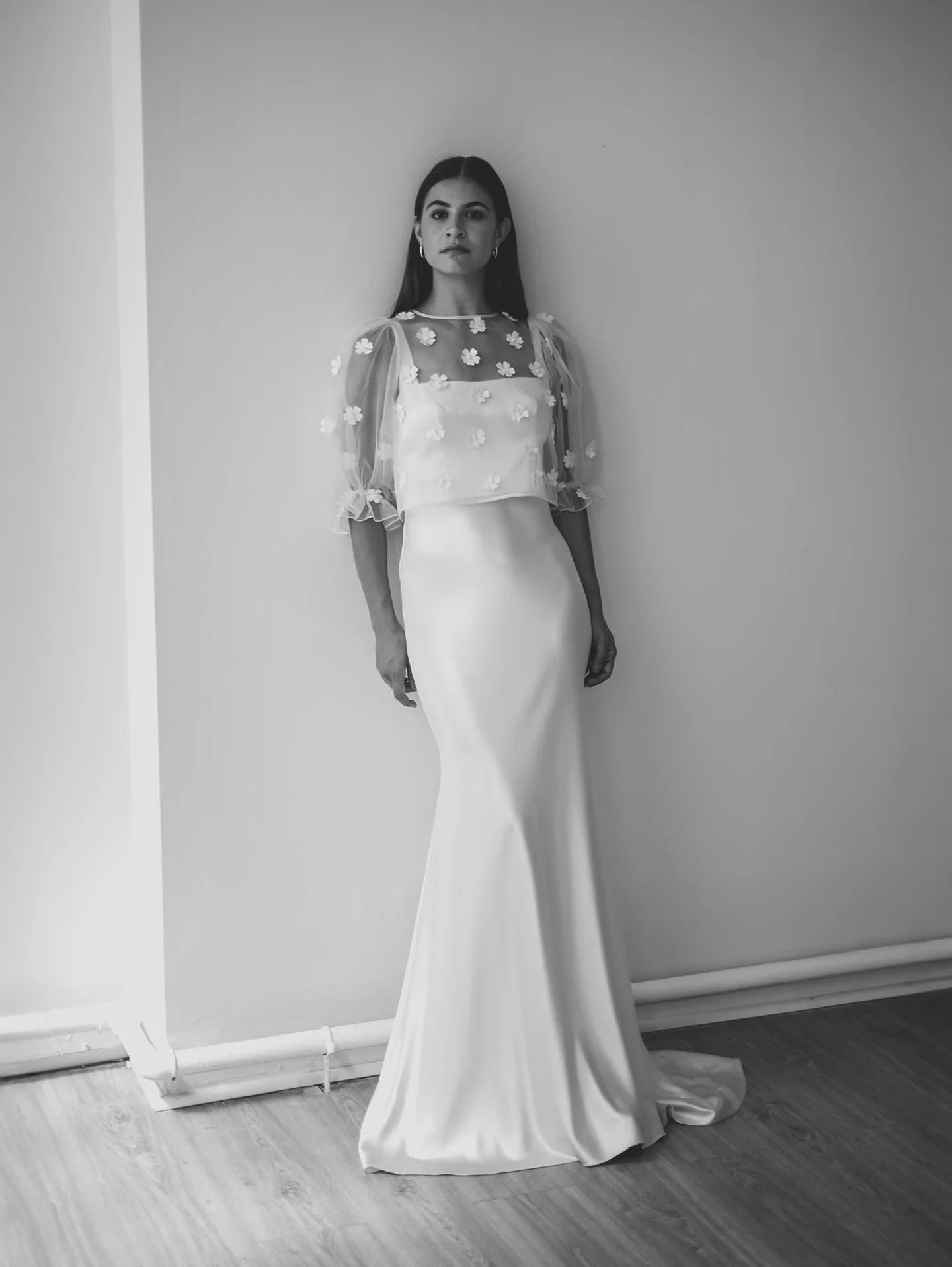 The MAE bridal top. Crafted from silk organza and adorned in pearl embellished satin and organza flowers. A transformative layering top that fuses romanticism with modernity and layers effortlessly over our contemporary bridal gowns. 

#bridaltop #br