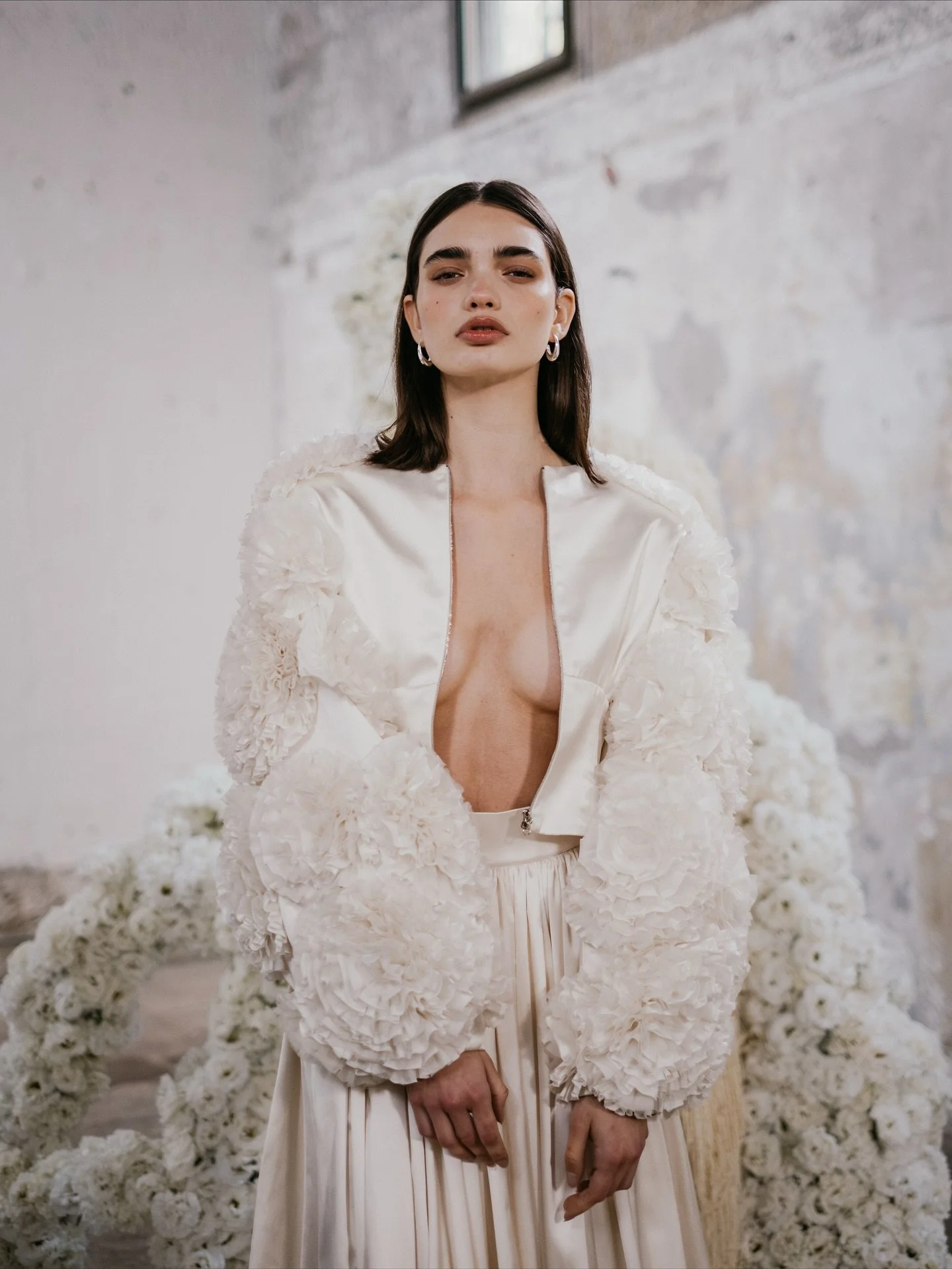 THE BRIDAL BOMBER
Introducing the LISIANTHUS bridal bomber. Designed for the UNBRIDLED STUDIO X FIONA FLEUR collaboration. Hand embroidered with layers of raw cut silk organza and satin. Every ruffle and fold mimics the natural form of the Lisianthu