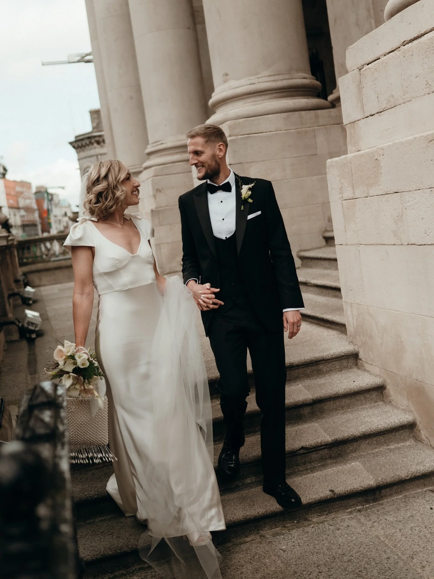 NICOLE. We couldn&rsquo;t wait to share these stunning images of Nicole and Leon&rsquo;s wedding in the Dublin&rsquo;s City Hall. Nicole wore a bias silk satin gown with structured bodice and sculptural cap sleeves, silk shoulder bows and a layered t