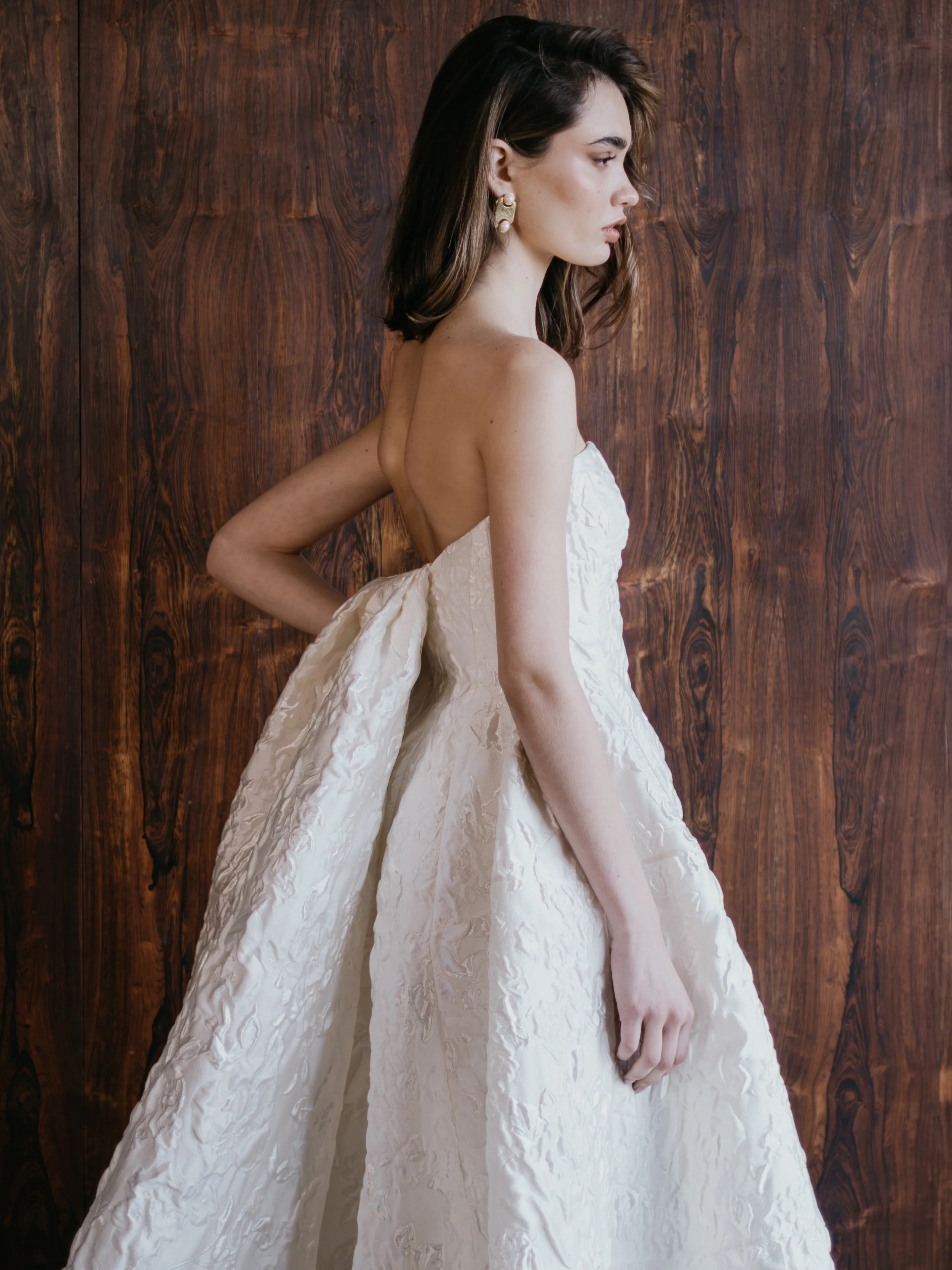 The AUBREY gown and RIVER detachable train. A structured bodice and sculptural skirt crafted from our textural satin jacquard. A refined and minimalist silhouette with just enough drama. 

Available to try at our studio now and arriving at selected  