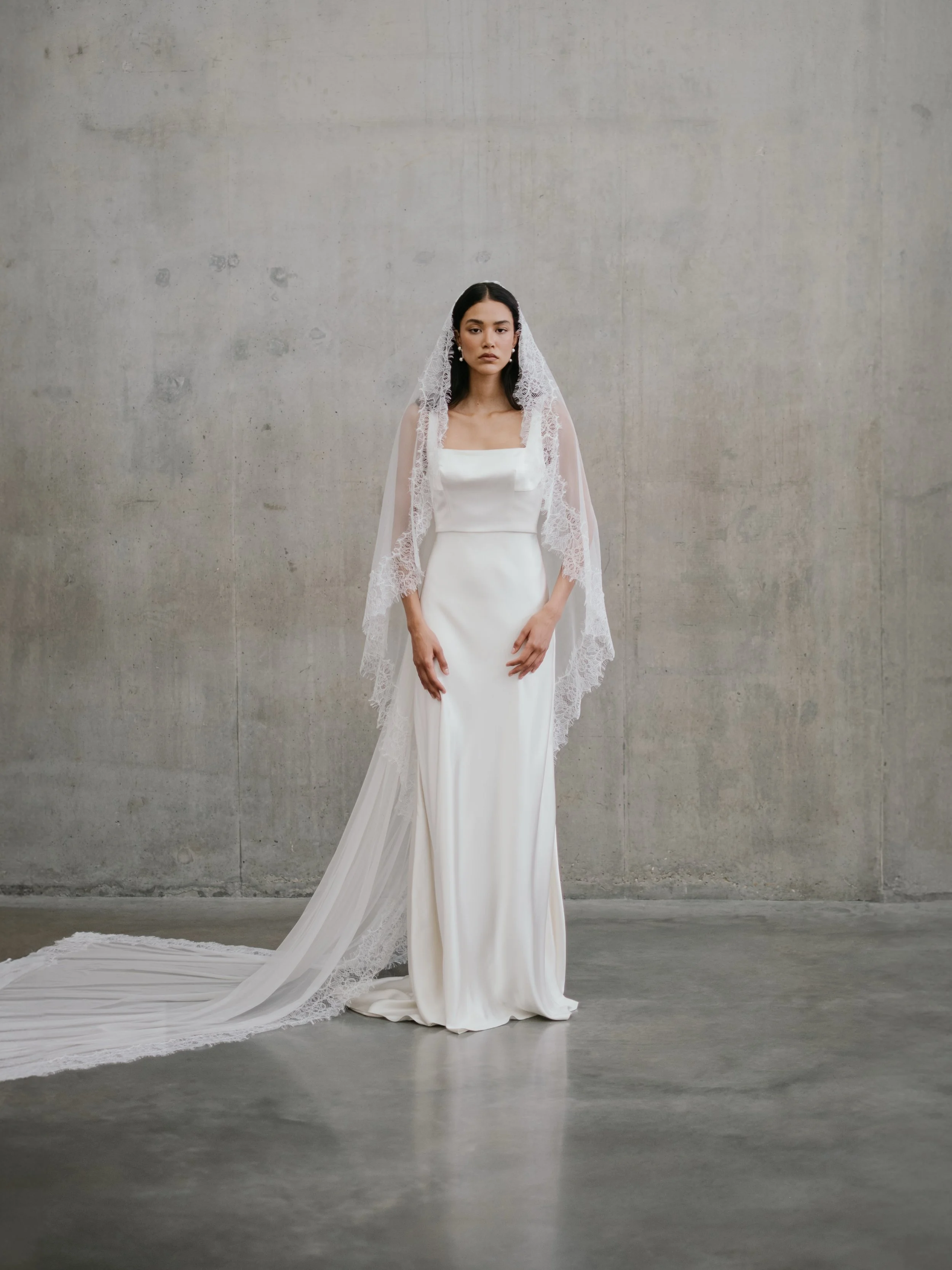 The CLARA gown and her endless versatility. 

Crafted from heavy silk crepe back satin, this clean and contemporary bridal gown has so many styling possibilities. Our layering tops and separates in sheer silk organza, silk satin and jacquard style ef
