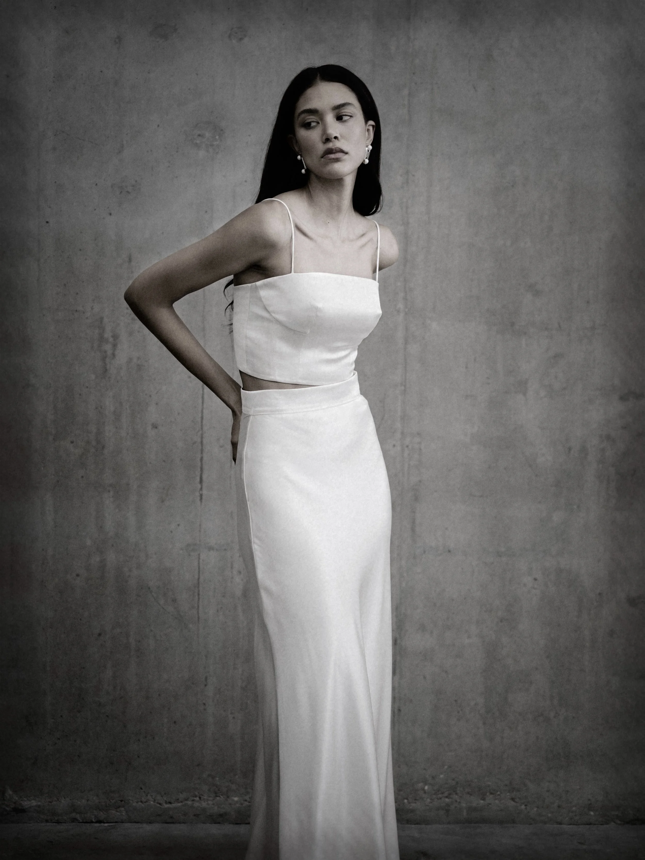 A nod to 90s minimalism- Bias cut silk satin, delicate shoe string straps and a clean and minimalist silhouette. This is a bridal look that is both nostalgic and timeless. Introducing the MAYA bodice and SOPHIA skirt- bridal &lsquo;slip dressing&rsqu
