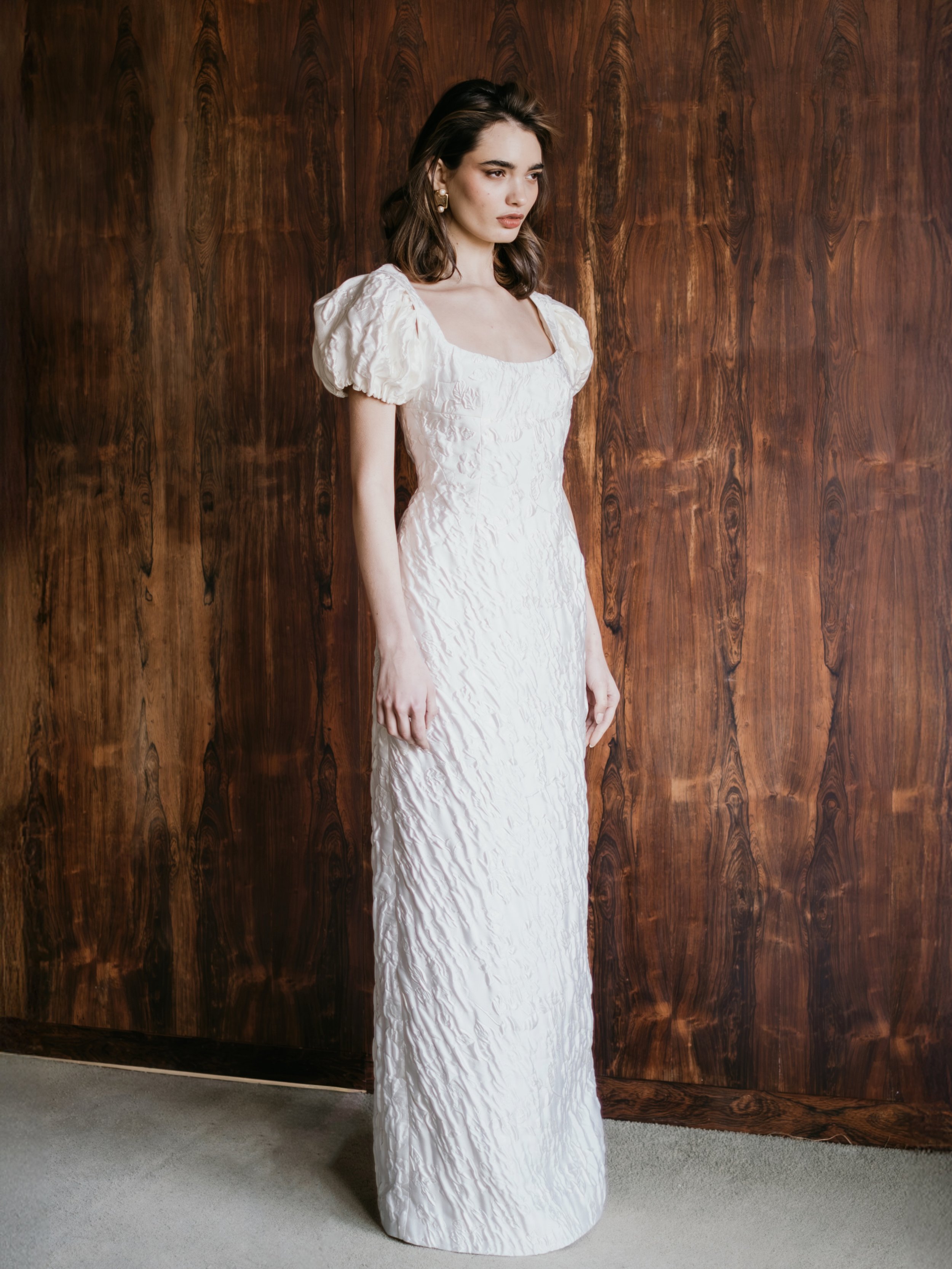 The MARGOT gown

A contemporary column bridal silhouette in rich crafted textures with a sculptural puff sleeve and chic centre back split. Designed for the modern bride.

The perfect choice for stylist city nuptials or a town hall ceremony.