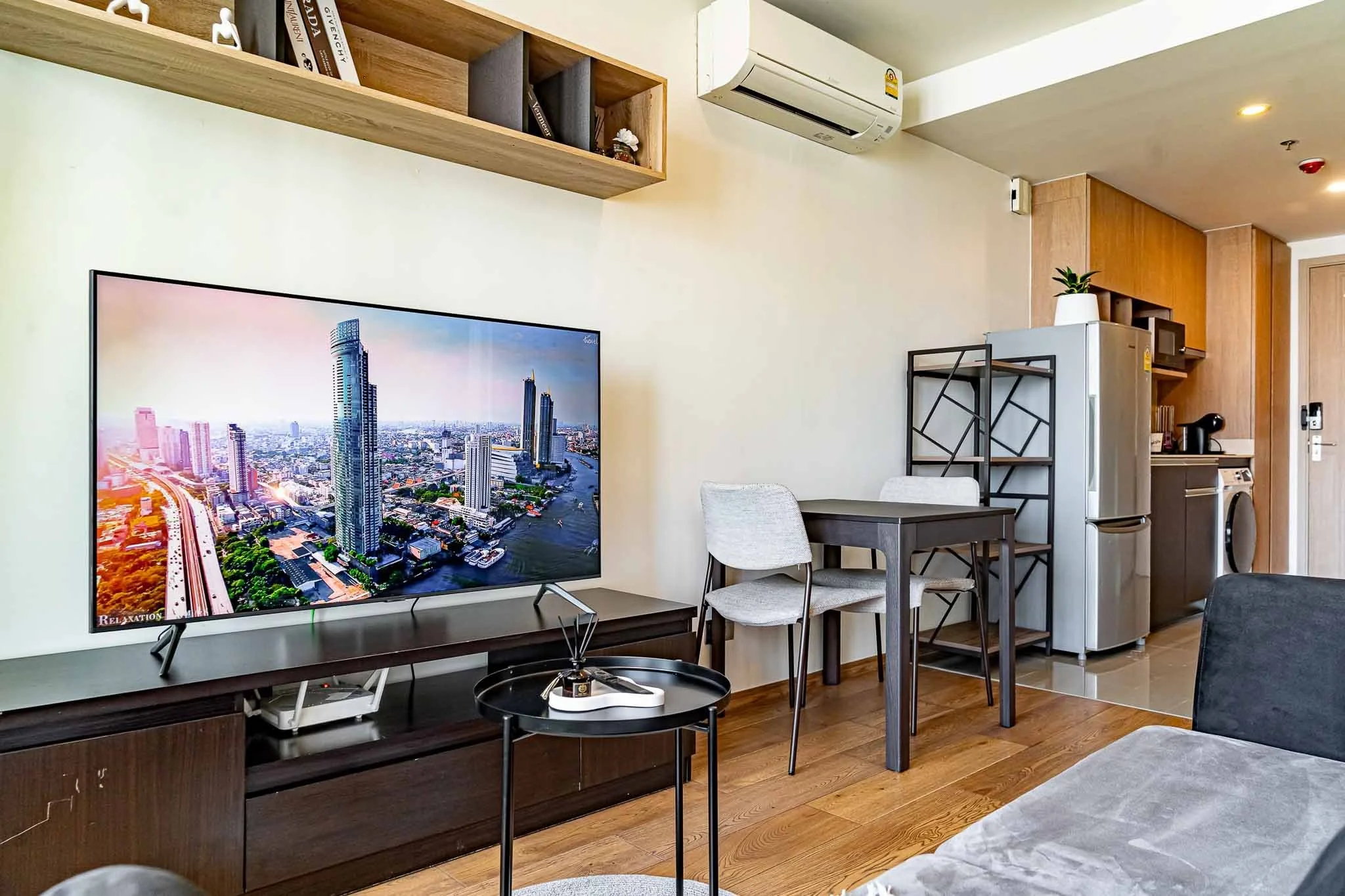 High-rise studio apartment with panoramic views of Bangkok's skyline.