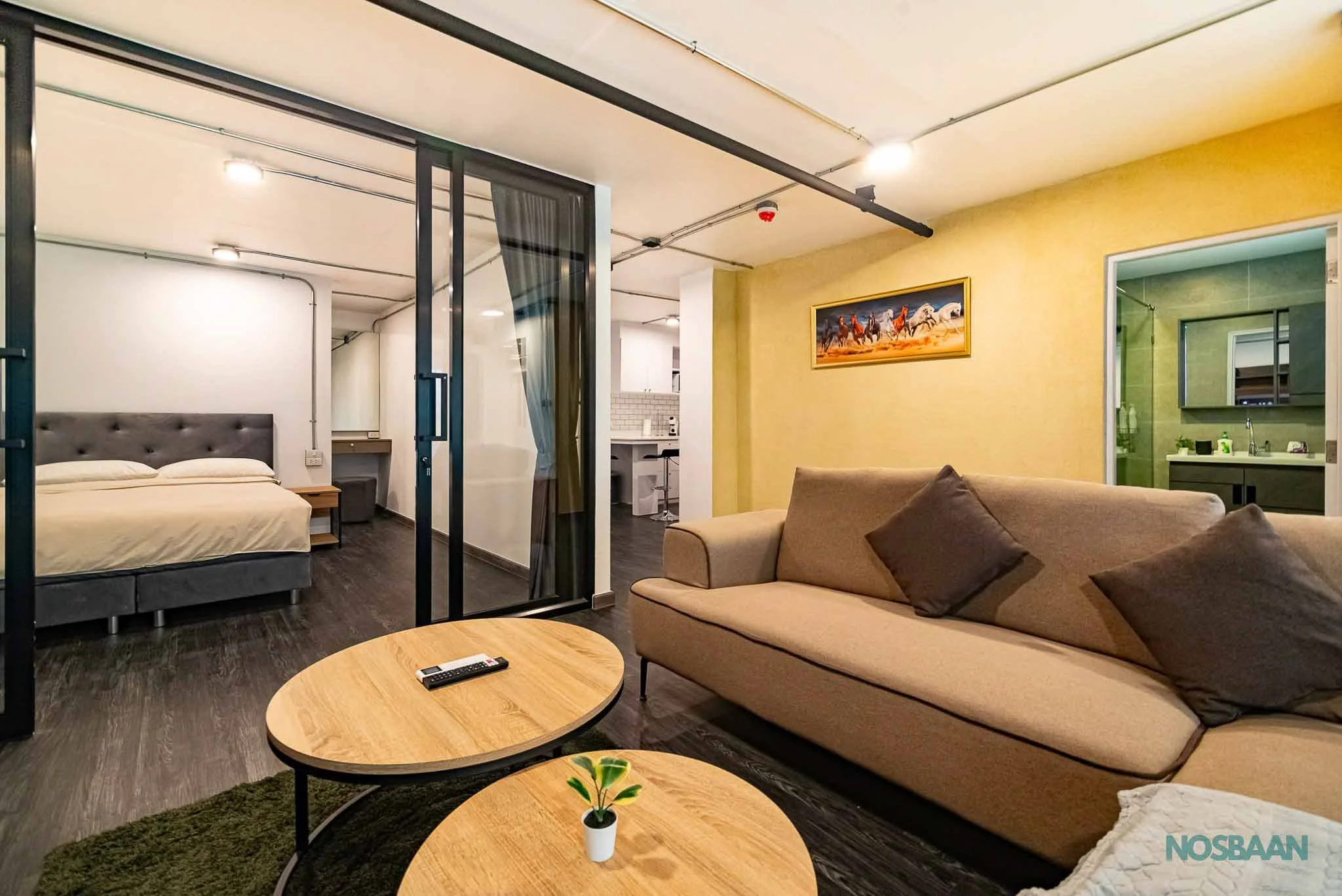 Contemporary one-bedroom apartment with sleek, neutral-colored interiors.