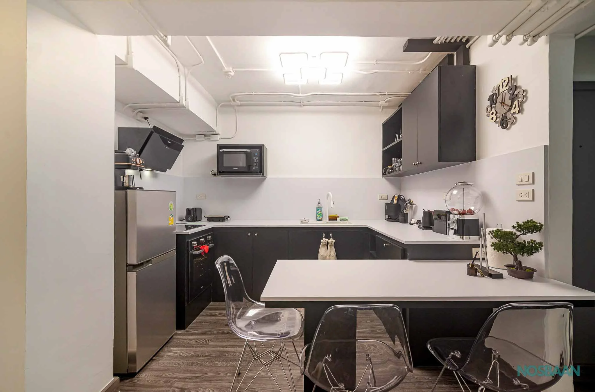 Bright and spacious apartment with modern lighting and a comfortable lounge area.