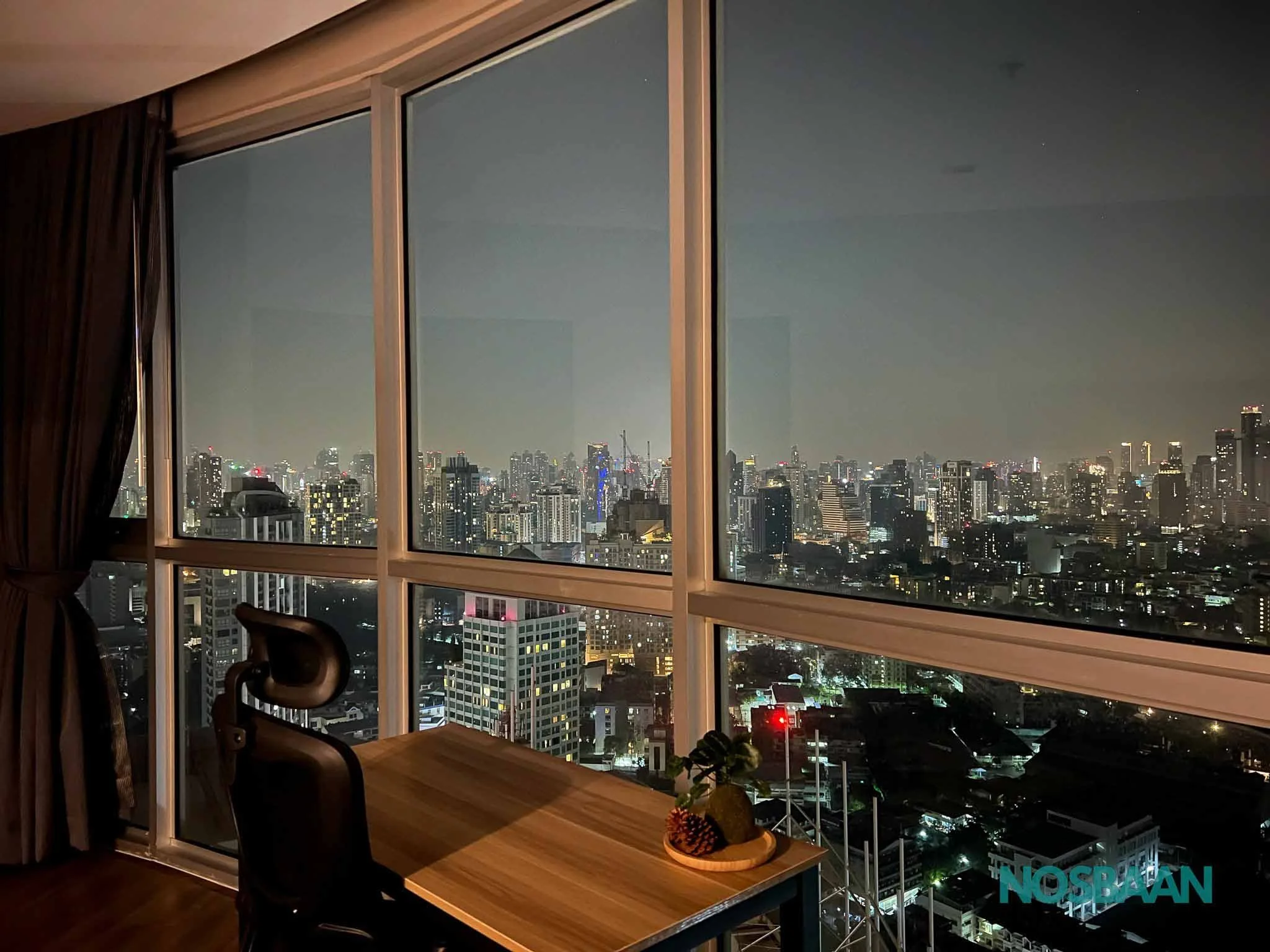 Stylish one-bedroom apartment with floor-to-ceiling windows and cityscape views.