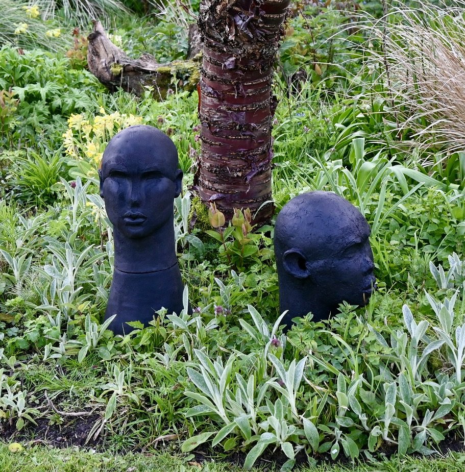 Tawny Phillips - black clay heads in David's garden.JPG