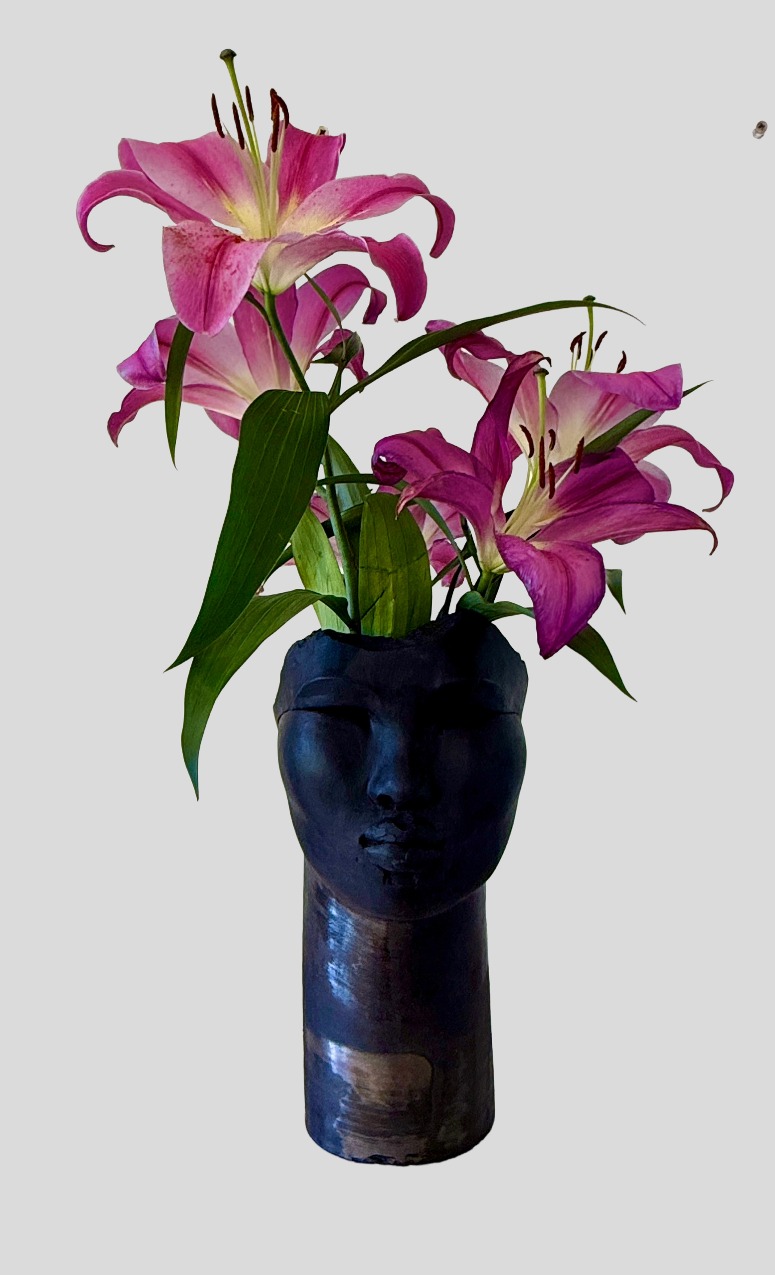 Tawny Phillips - open head sculpture with metallic glaze.png