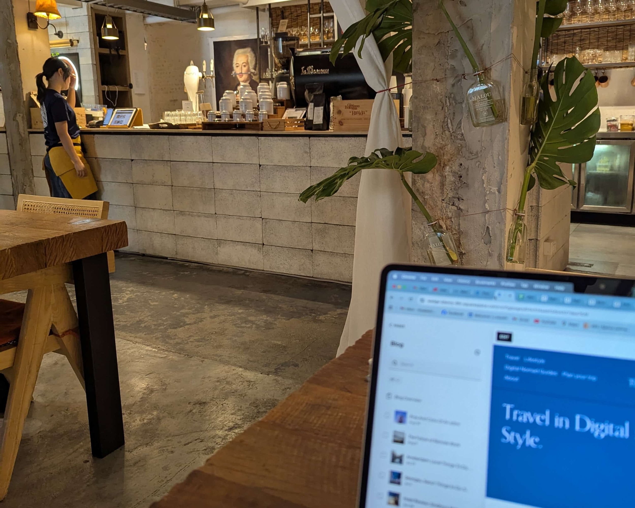 a laptop screen and a cafe