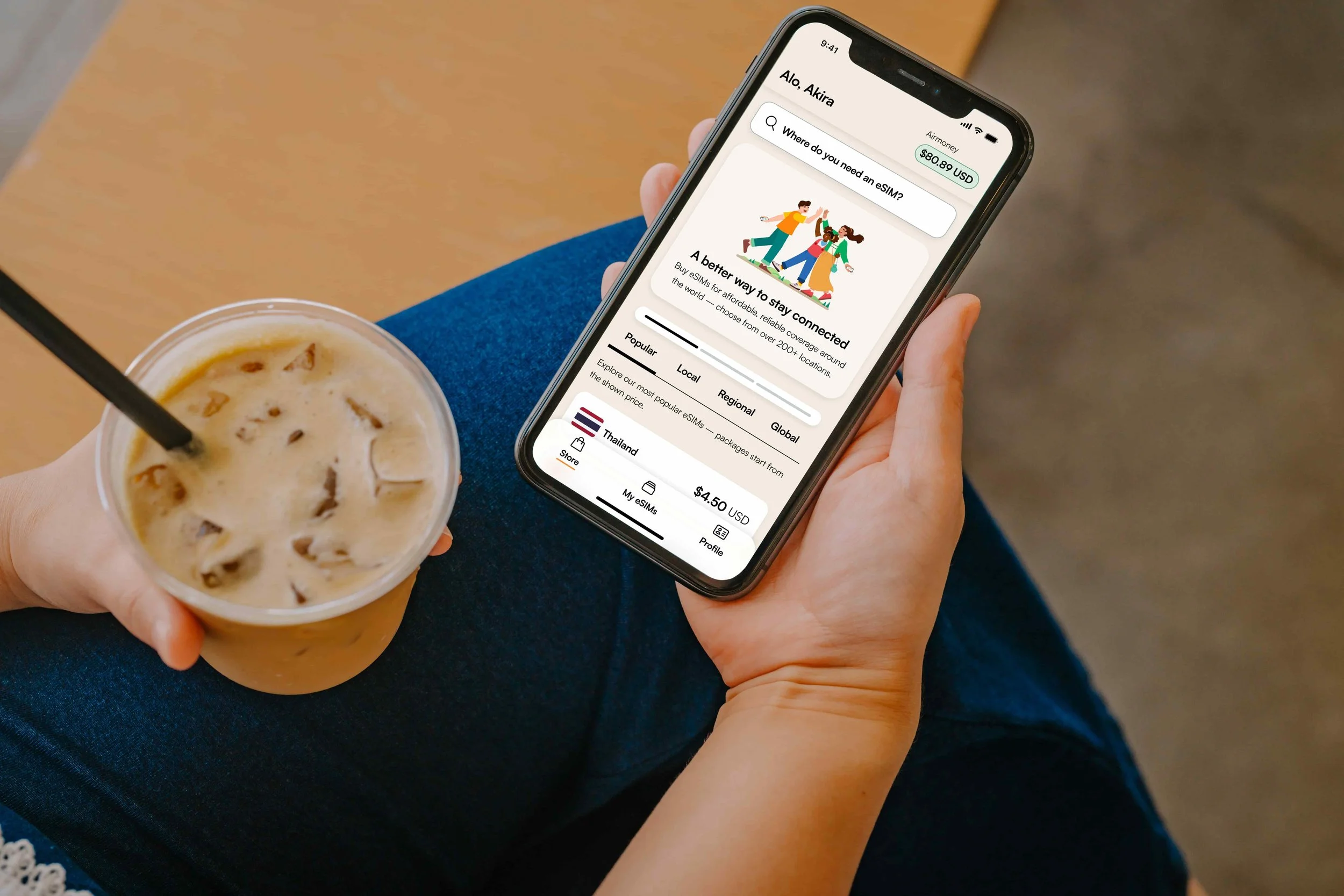 A phone showing an esim and a coffee