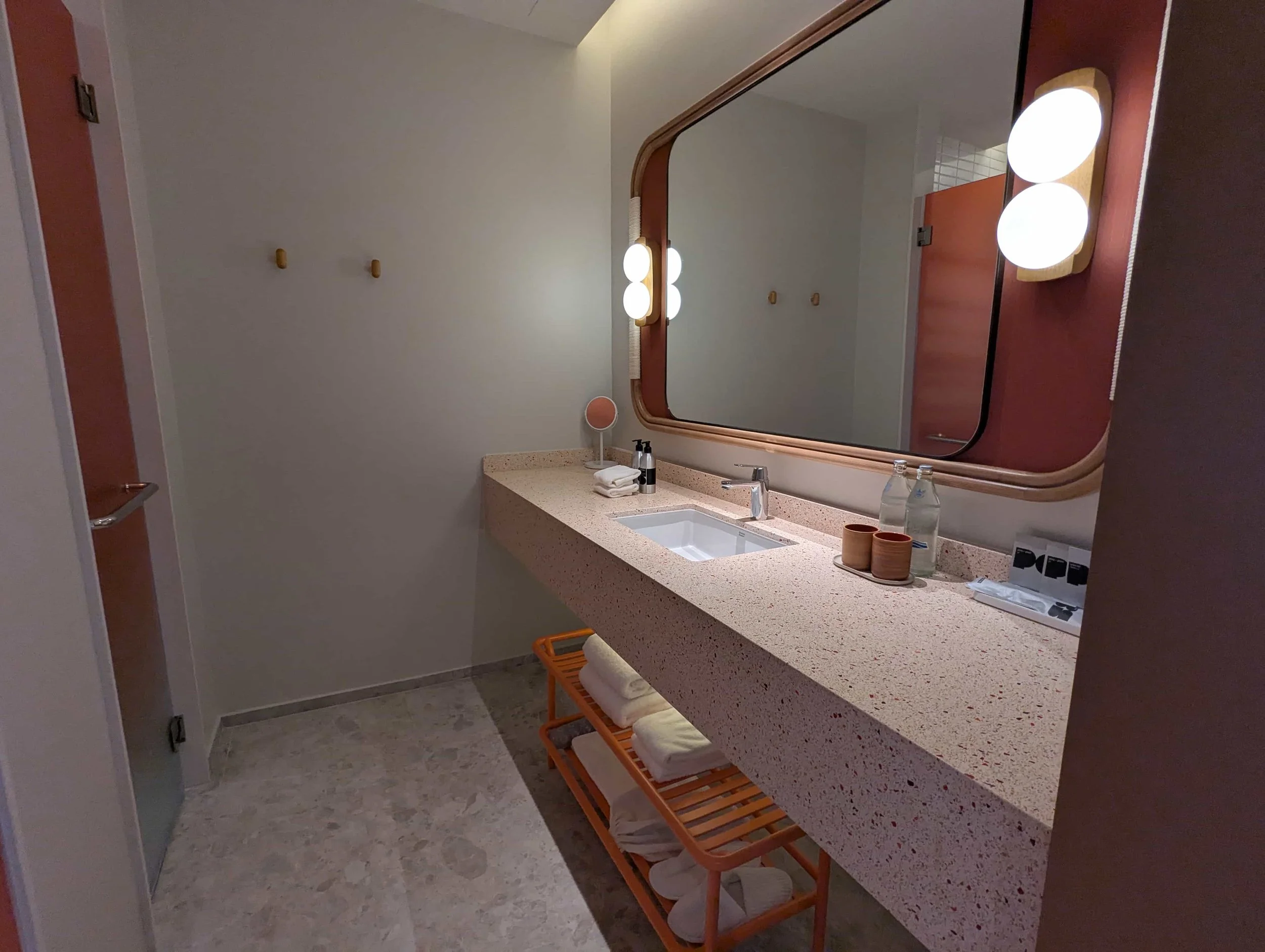 Bathroom with red and orange accents at the Standard Hotel Na Jomtien