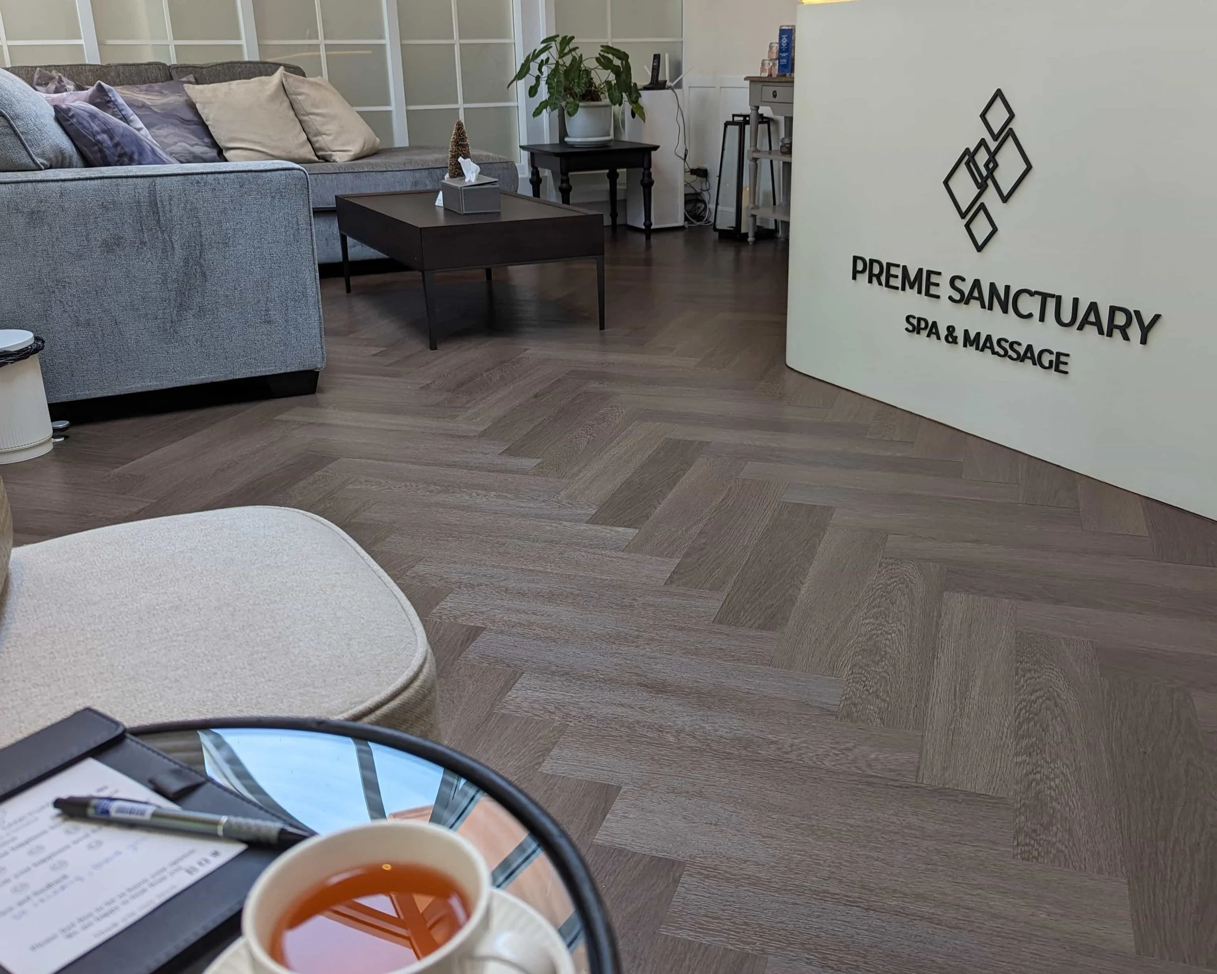 A Spa reception with a wooden floor and a tea