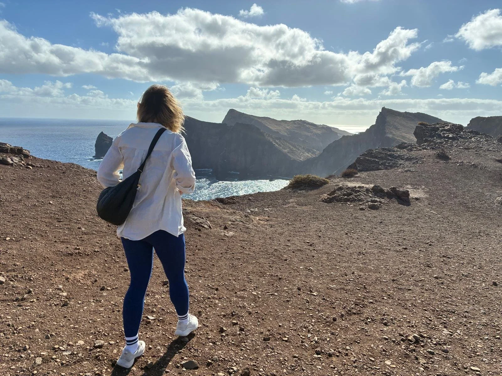 A woman walking on the cliffs on Madeira