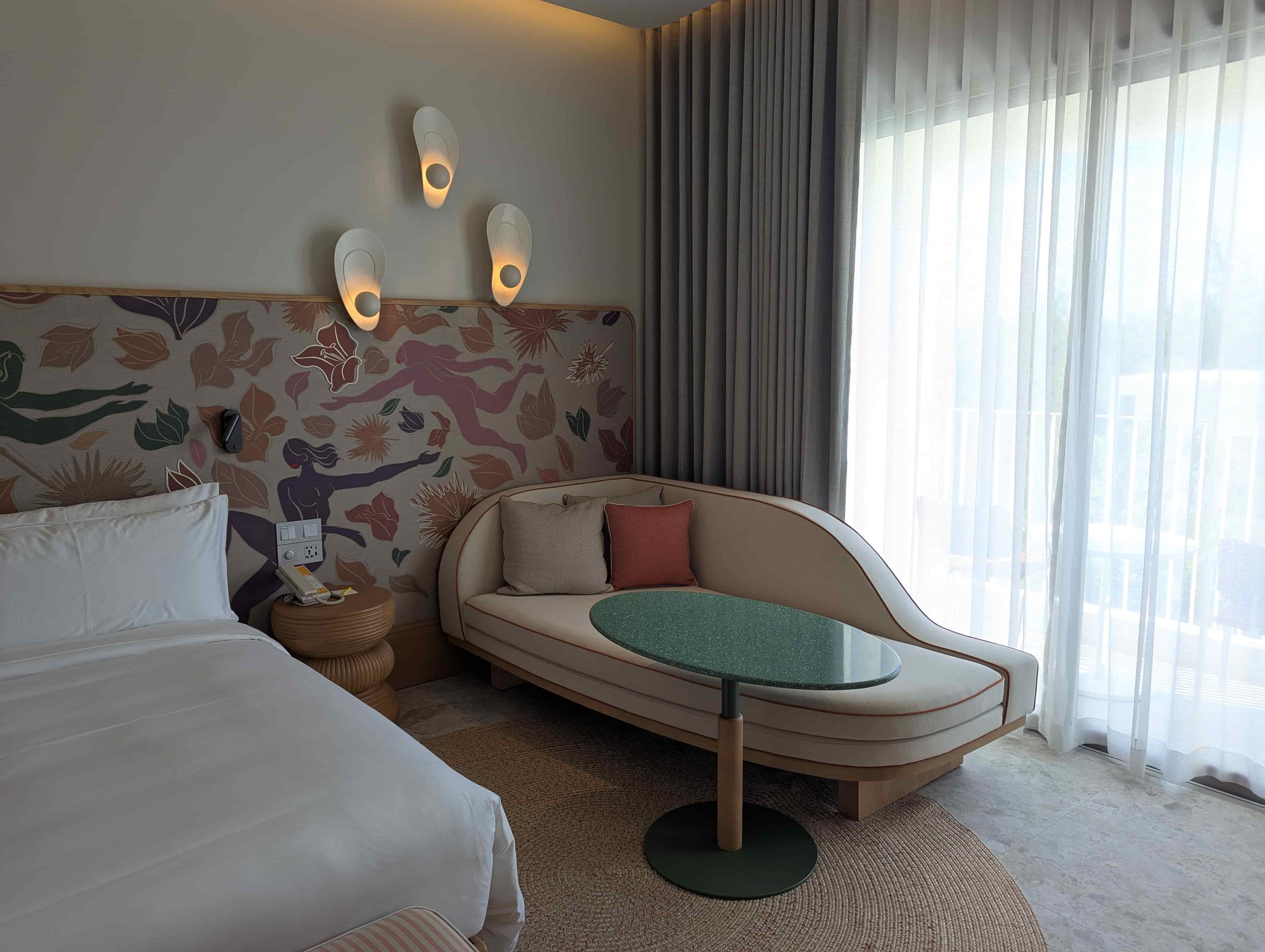 Hotel room with couch and bed at The Standard Na Jomtien