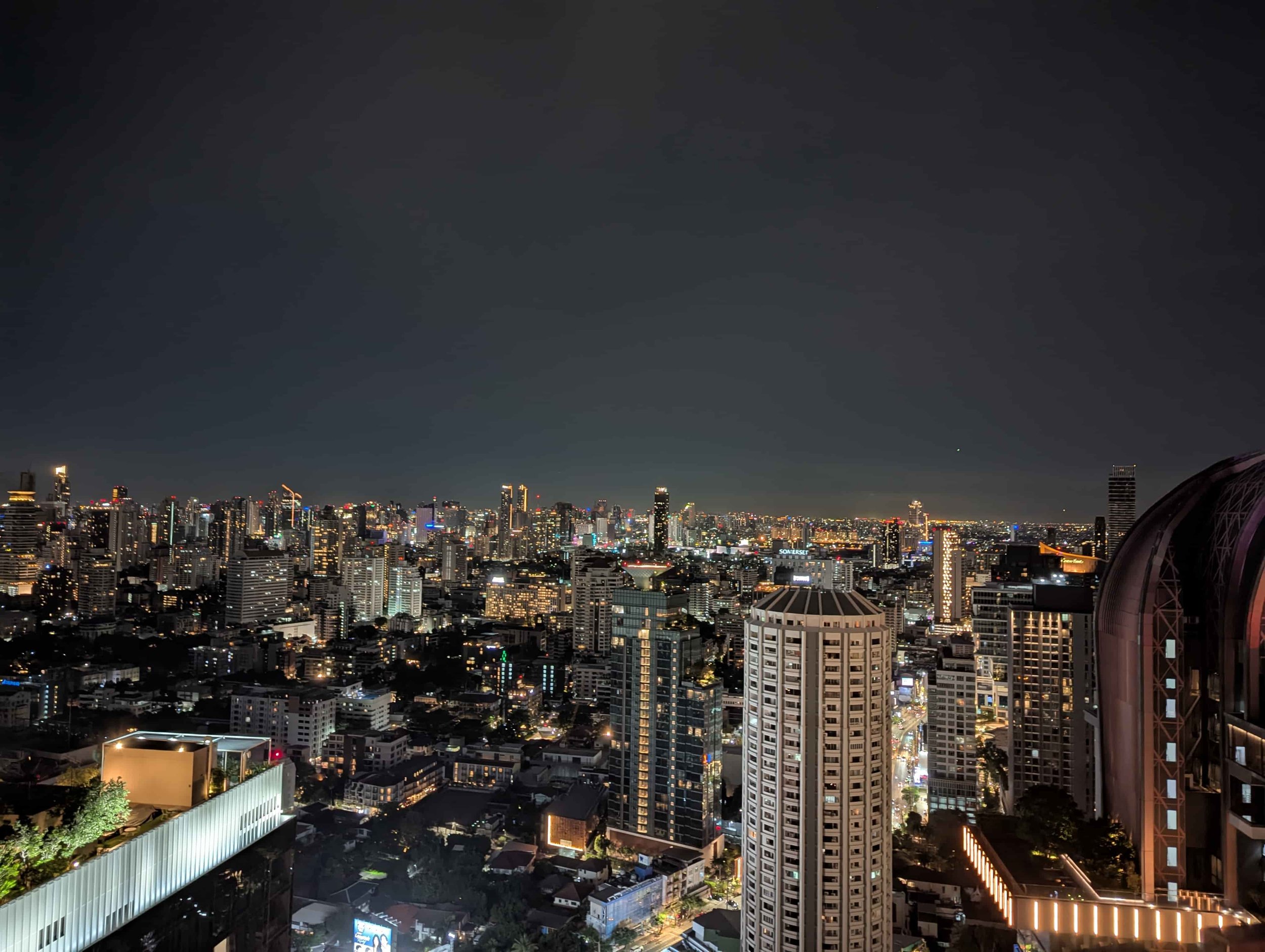Bangkok skyline from a rooftop by night
