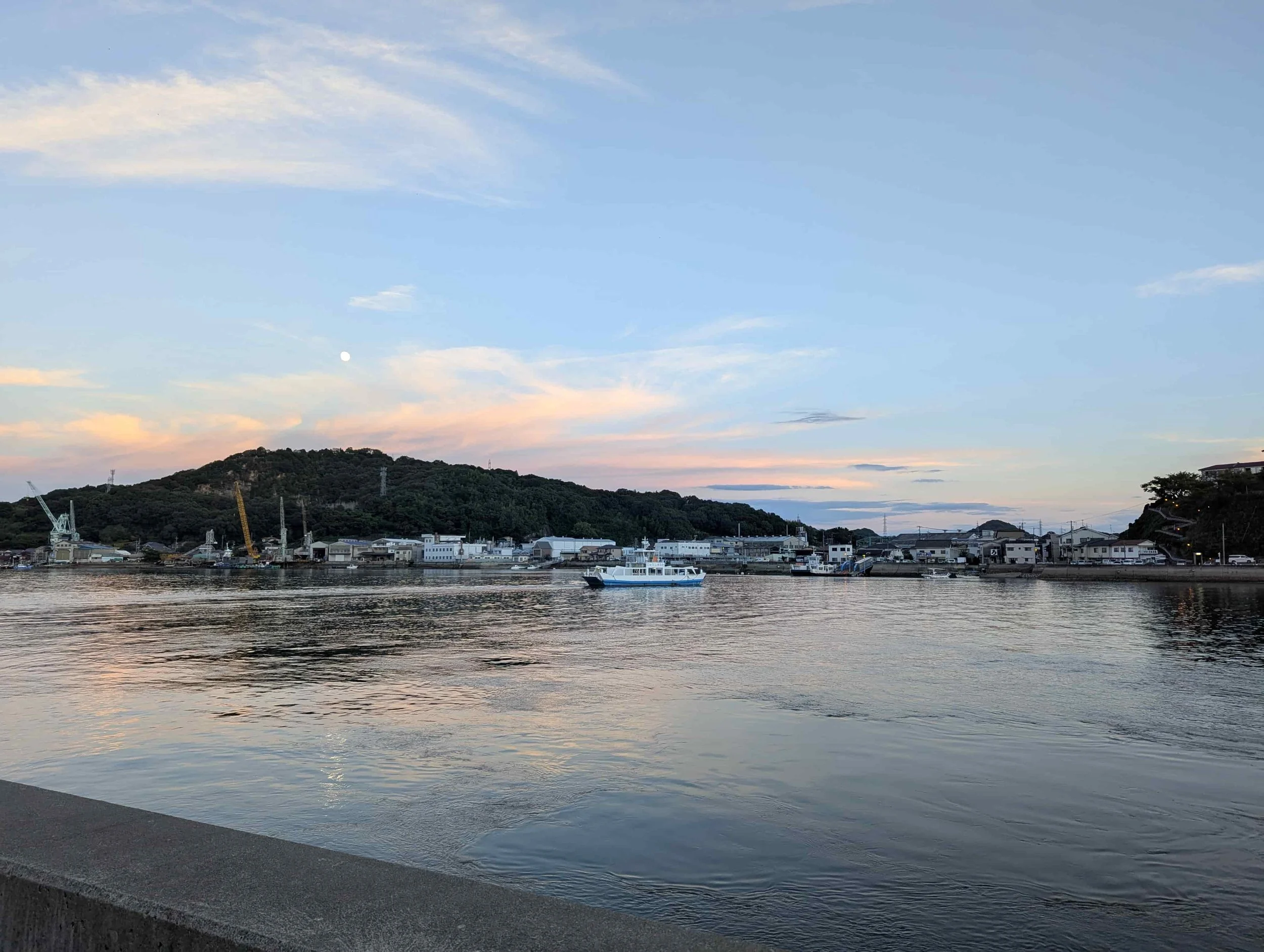 View on Onomichi harbour and a ferry at sunset