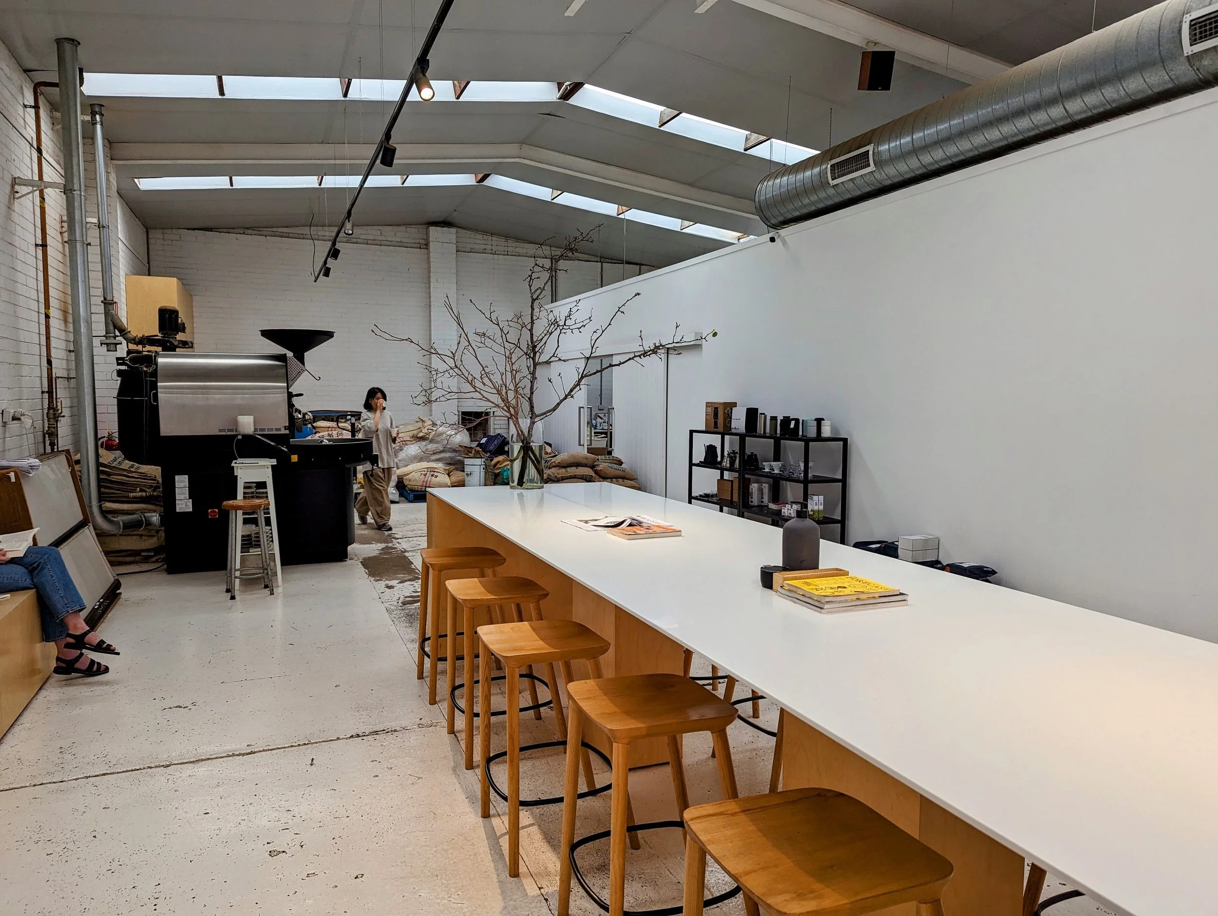 a cafe with a  white industrial decor