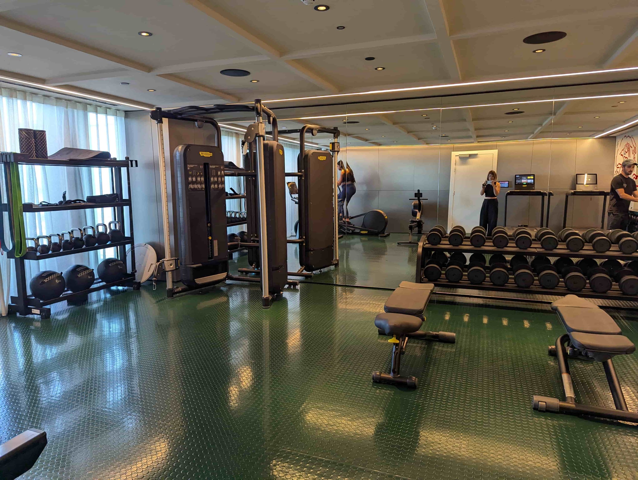 A gym with weights and other fitness machines at The Standard Hotel Brussels