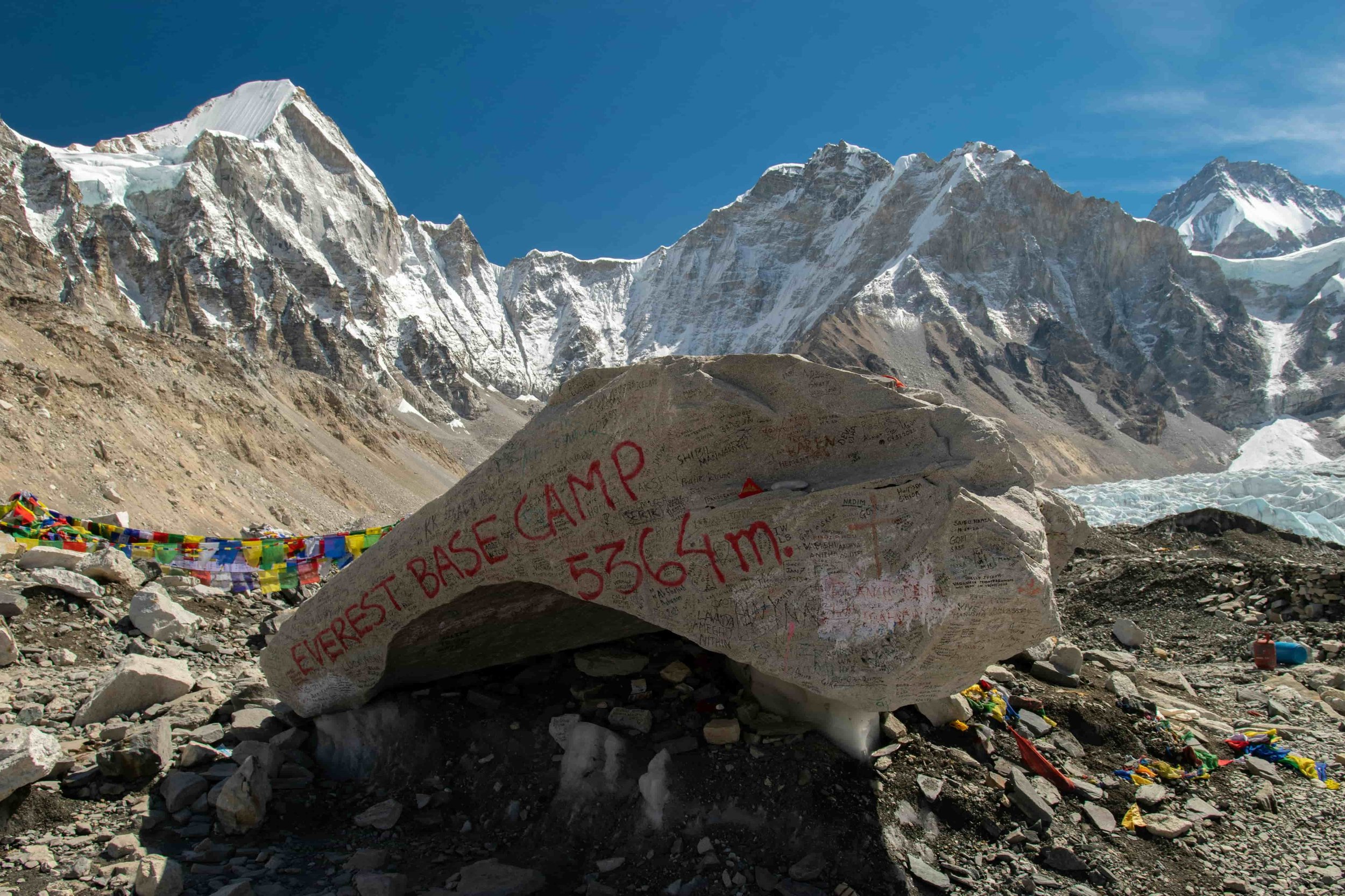 View on the Everest mountains and a sign with everest base camp written on it