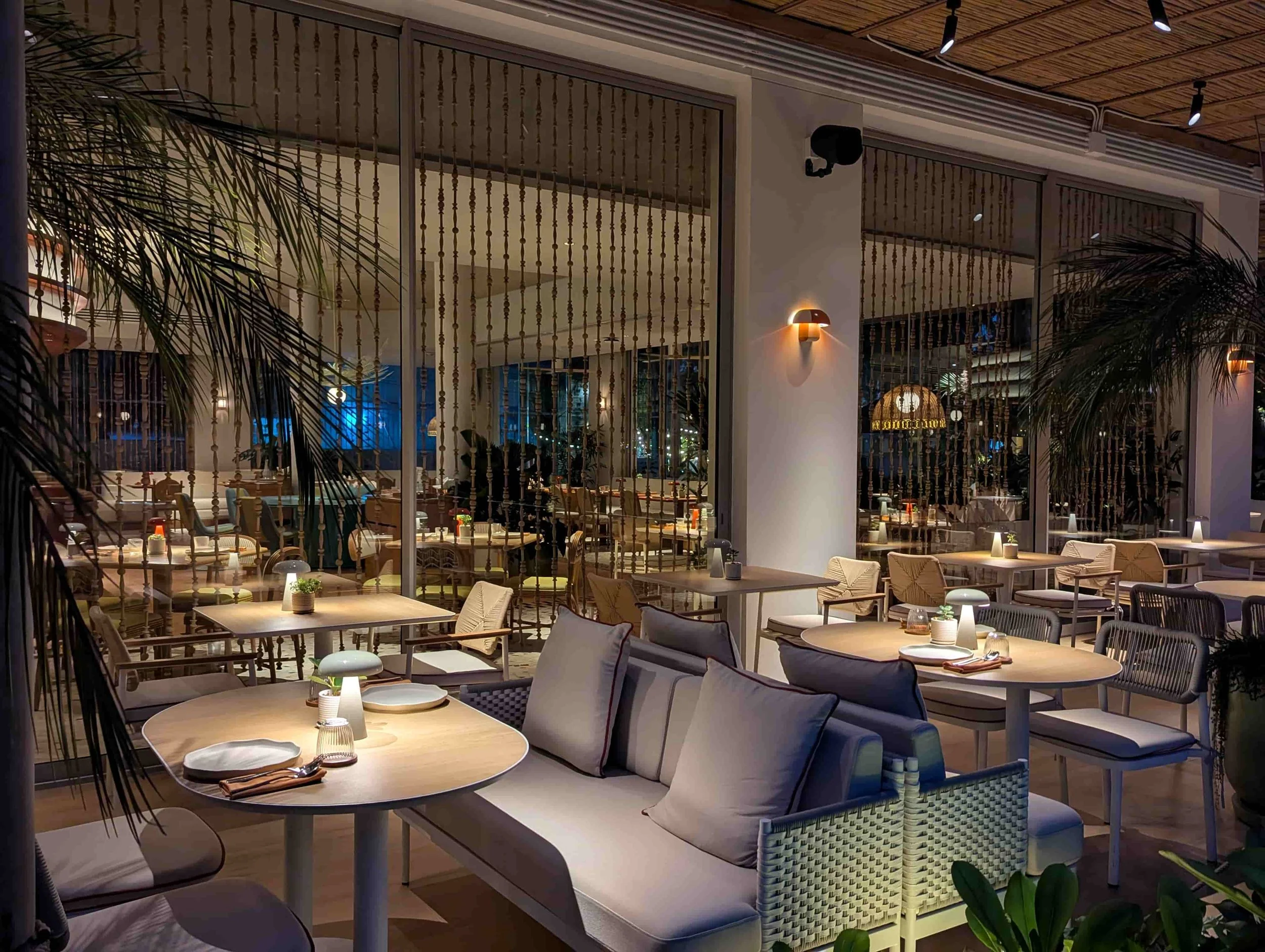 Tables and chairs at the Sereia Coastal Grill restaurant at The Standard Hotel, Na Jomtien