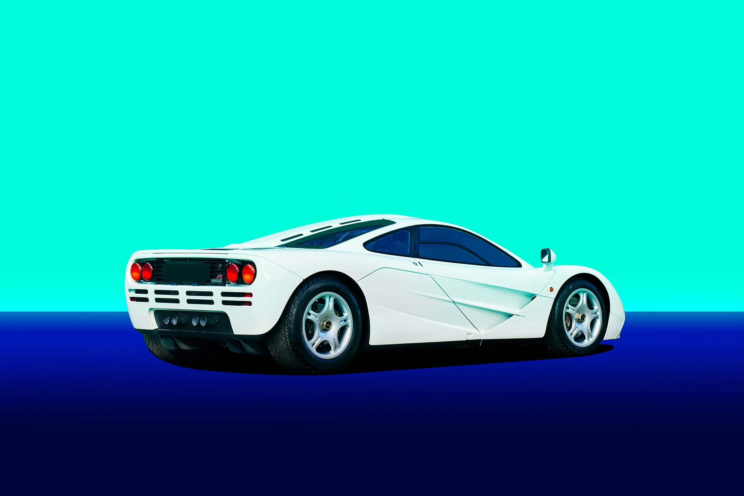 White McLaren F1 shot for Kidston at Retromobile