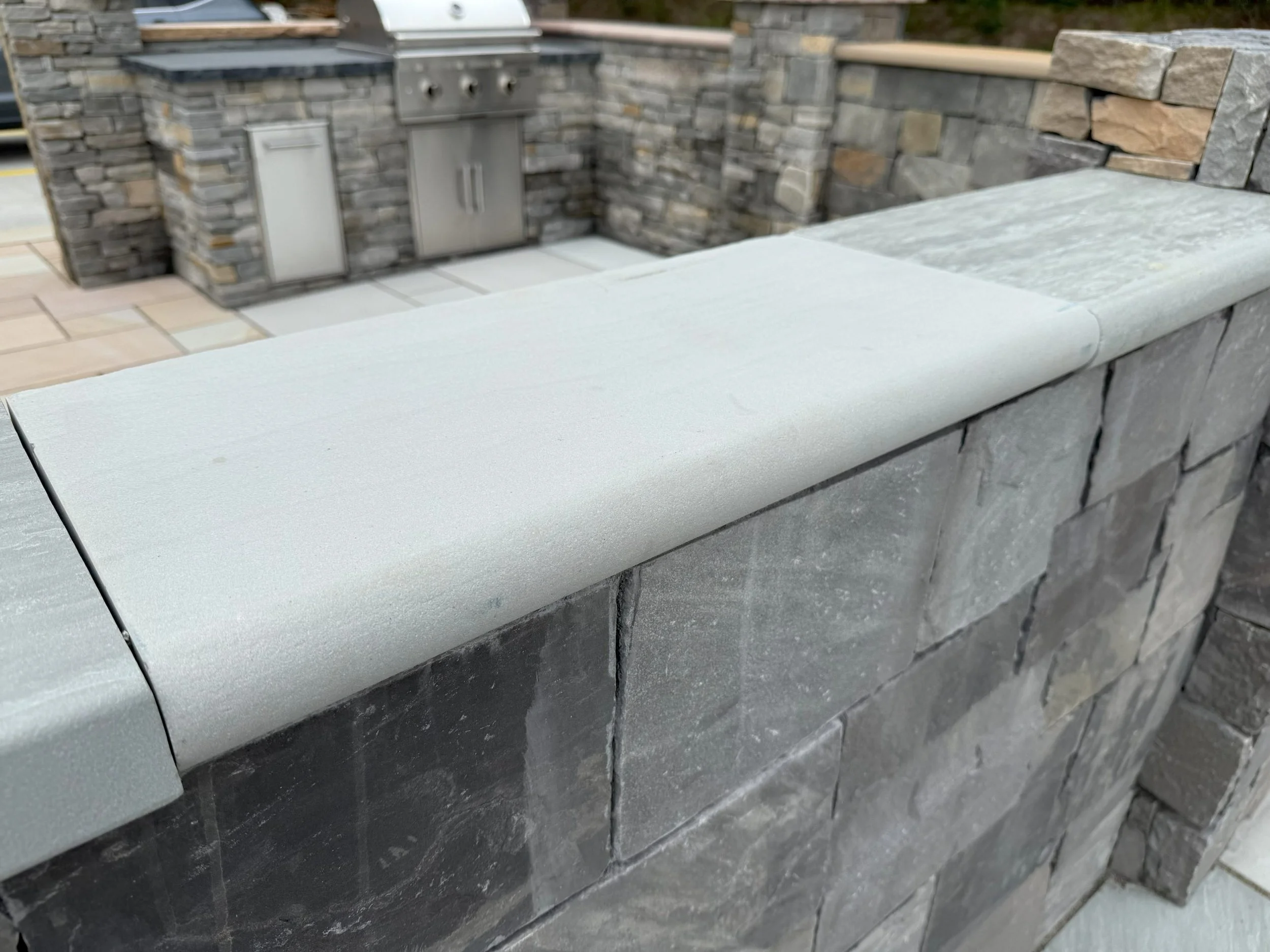 Castle-Grey-Wall-Cap-Sawn-Sandblasted-Bullnose-Edge-scaled.jpg