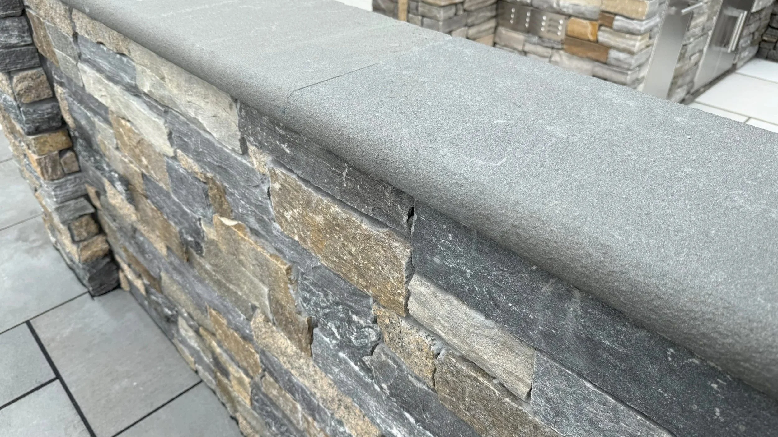 Blue-Stone-Wall-Cap-Flamed-Bullnose-Edge-scaled.jpg