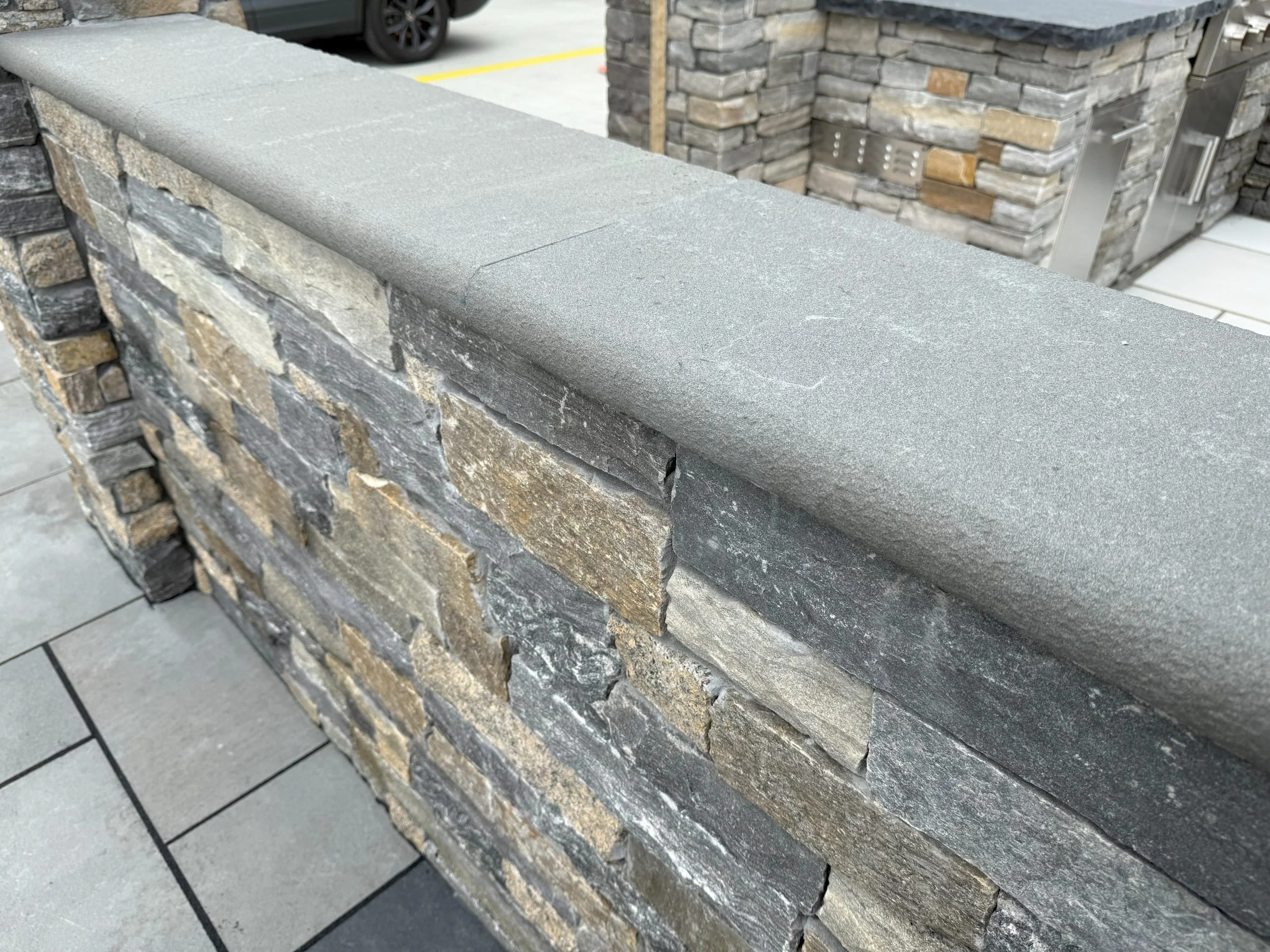 Blue-Stone-Wall-Cap-Flamed-Bullnose-Edge-scaled.jpg