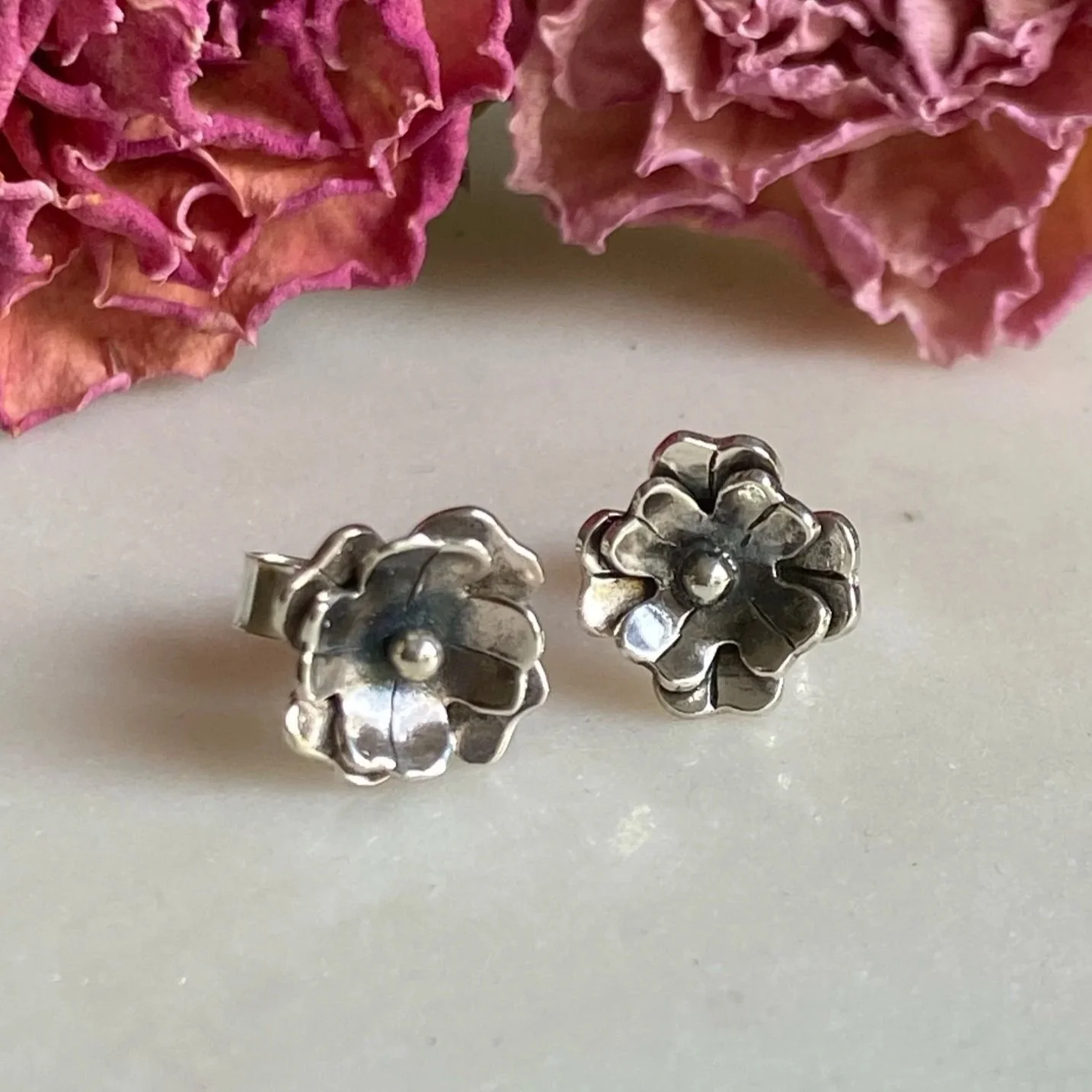 Handmade, sterling silver, flower, stud earrings. Handcrafted by Walter and Nancy Jewellery.