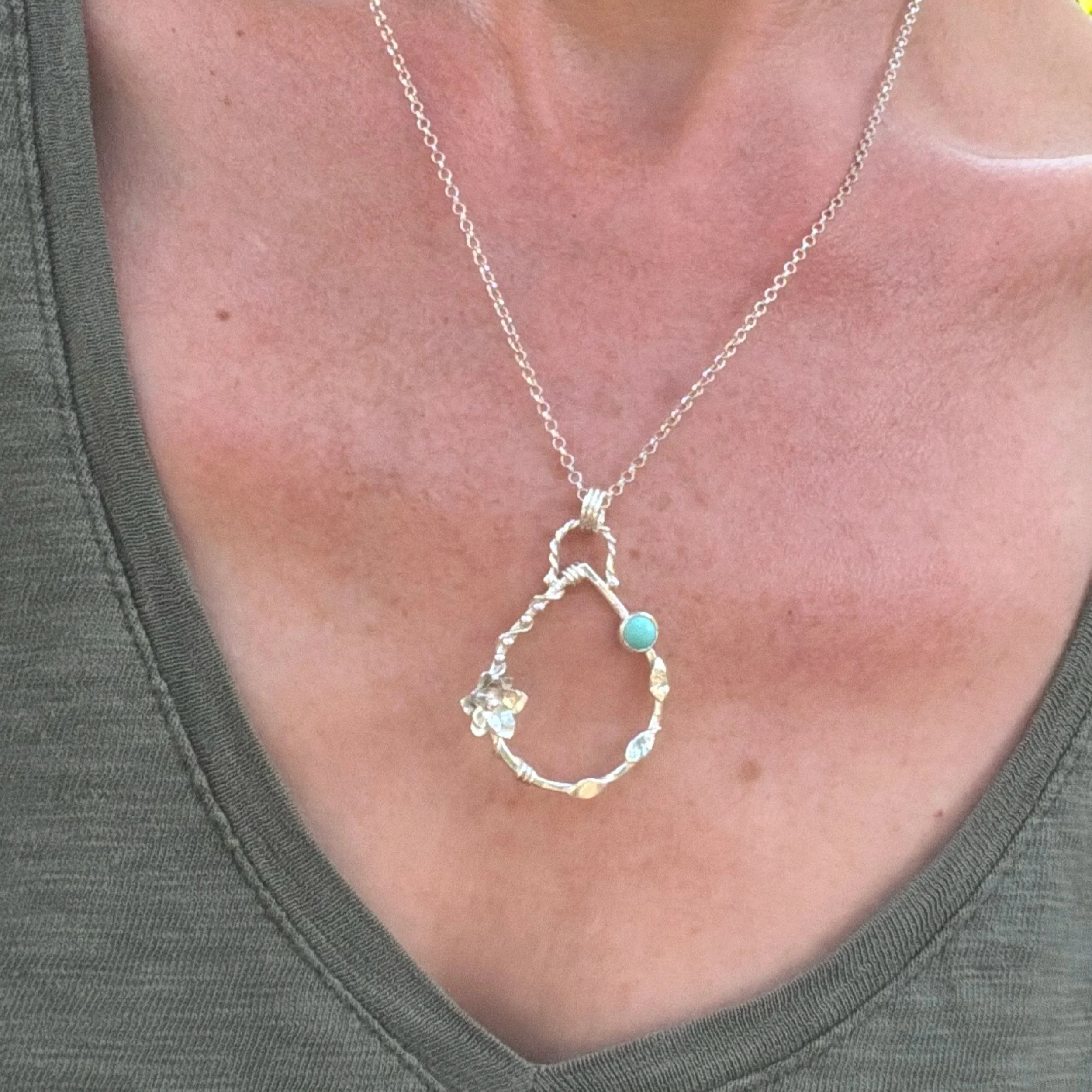 Handcrafted, botanical, sterling silver and turquoise pendant. Handmade by Walter and Nancy Jewellery.IMG_6249.jpg