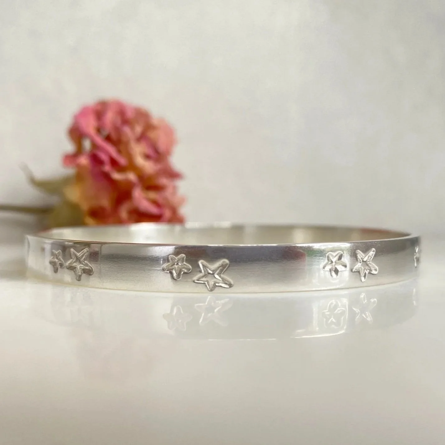 Handmade sterling silver luxury double star bangle.