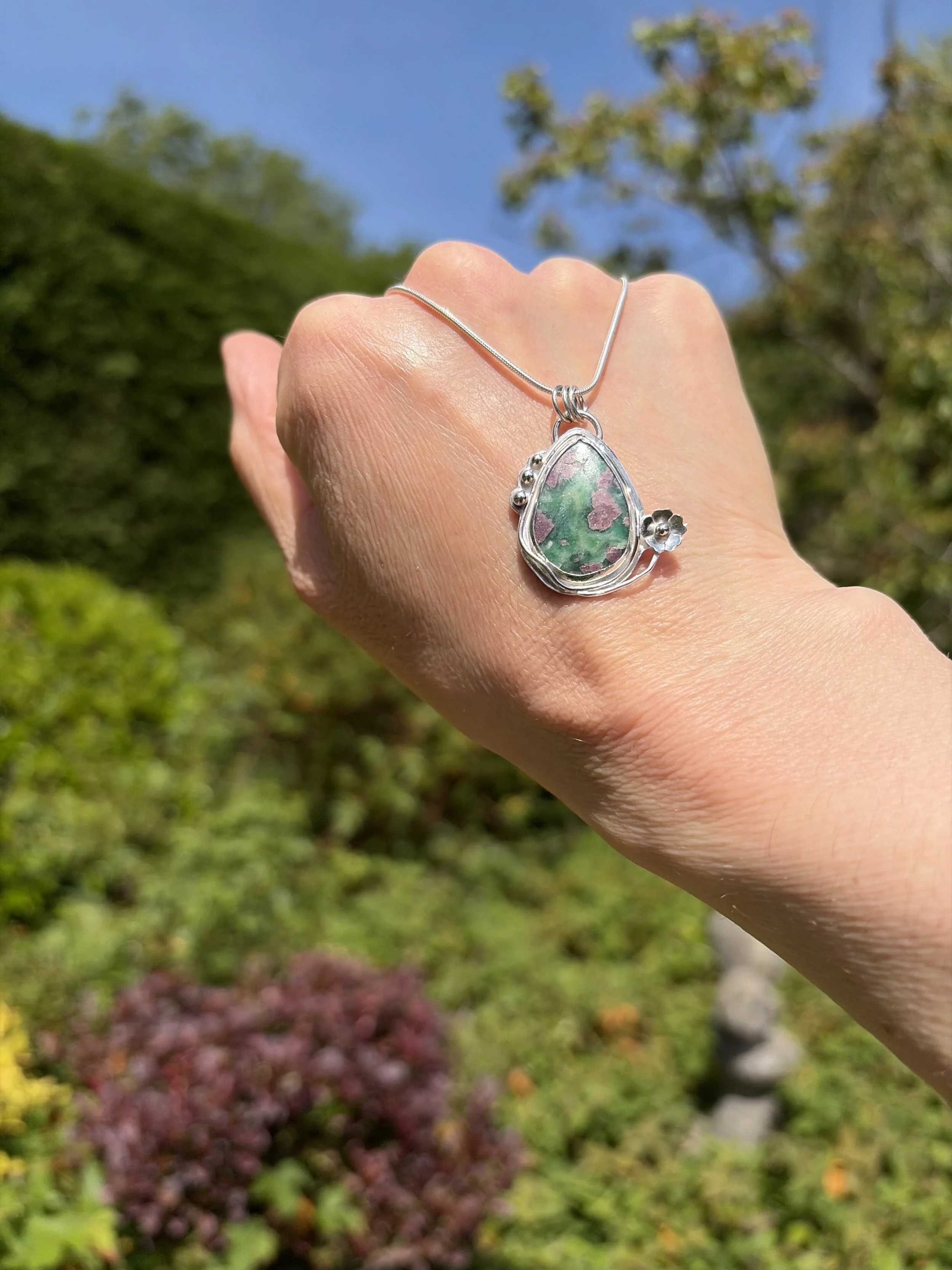 A beautiful Ruby Fuchsite stone set in a handcrafted sterling silver setting. The setting has been hallmarked in London. The piece has been designed and made by Rosie at Walter and Nancy Jewellery.