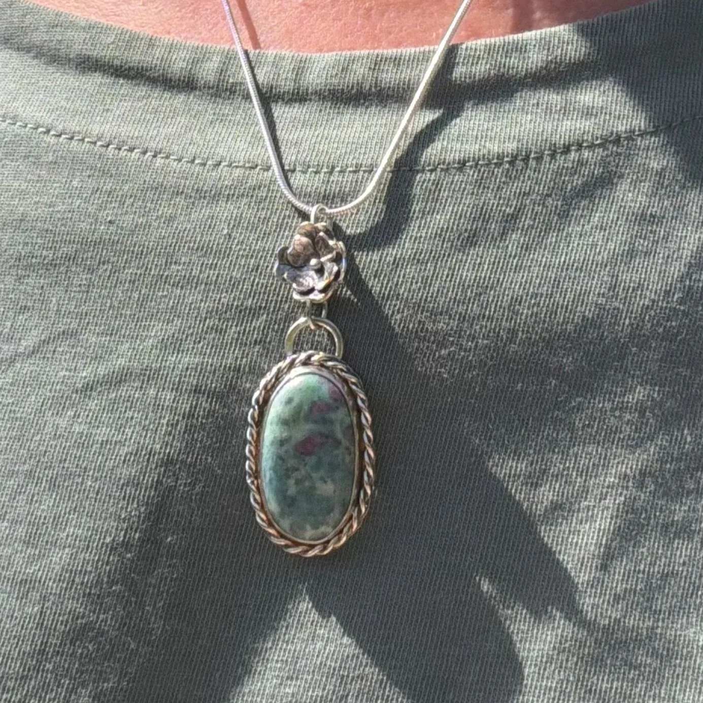A beautiful Ruby Fuchsite stone set in a handcrafted sterling silver setting. The setting has been hallmarked in London. The piece has been designed and made by Rosie at Walter and Nancy Jewellery.
