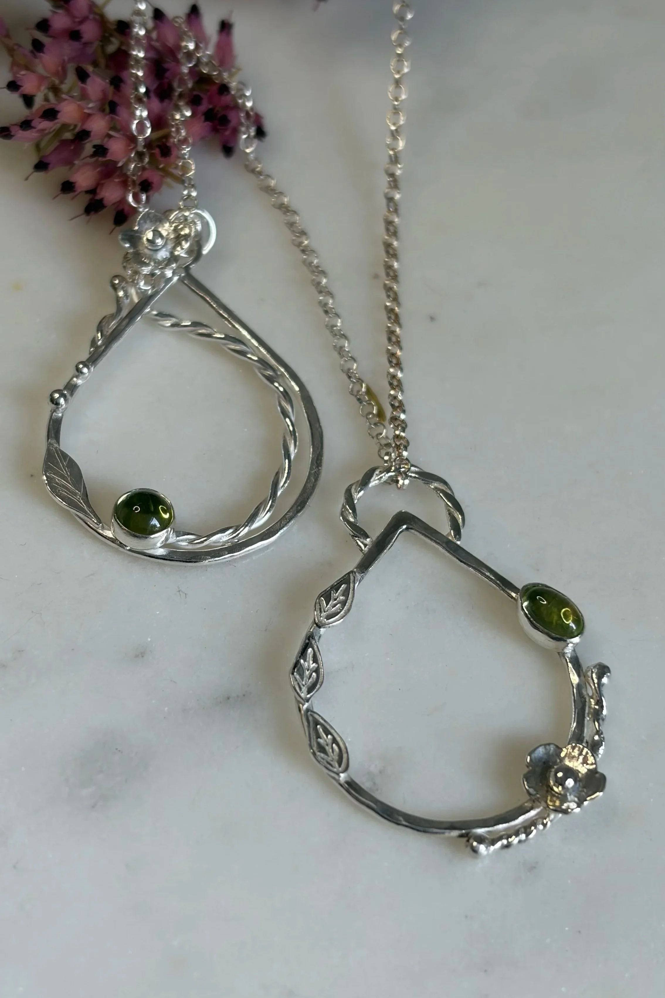 Handcrafted, botanical, sterling silver and peridot pendant. Handmade by Walter and Nancy Jewellery.