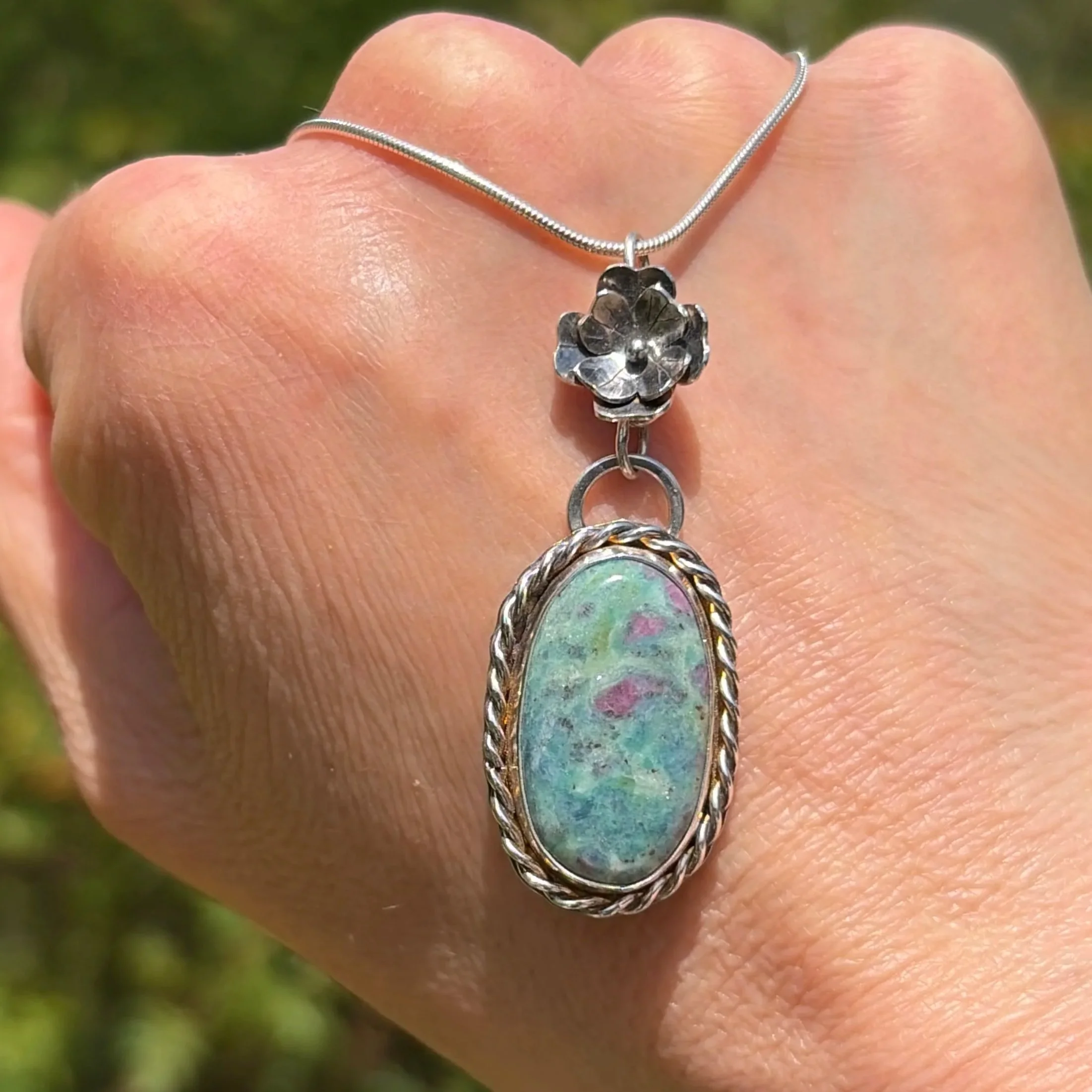 A beautiful Ruby Fuchsite stone set in a handcrafted sterling silver setting. The setting has been hallmarked in London. The piece has been designed and made by Rosie at Walter and Nancy Jewellery.