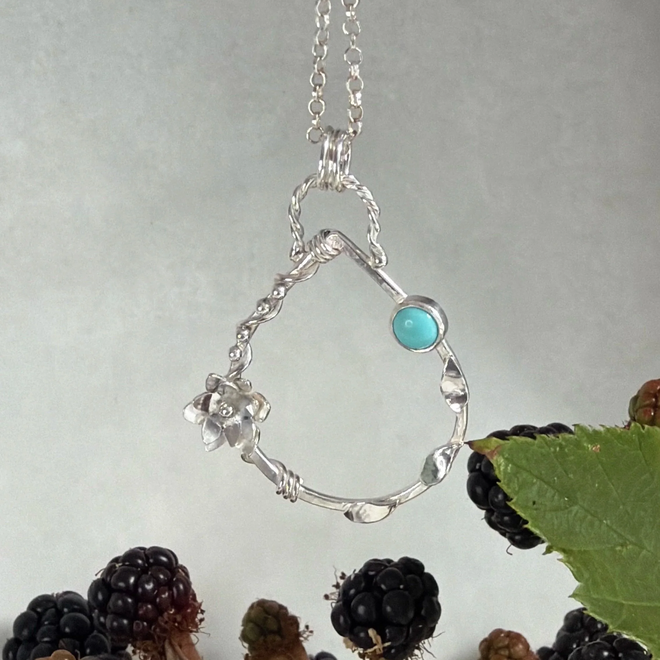Handcrafted, botanical, sterling silver and turquoise pendant. Handmade by Walter and Nancy Jewellery.IMG_6260.jpg