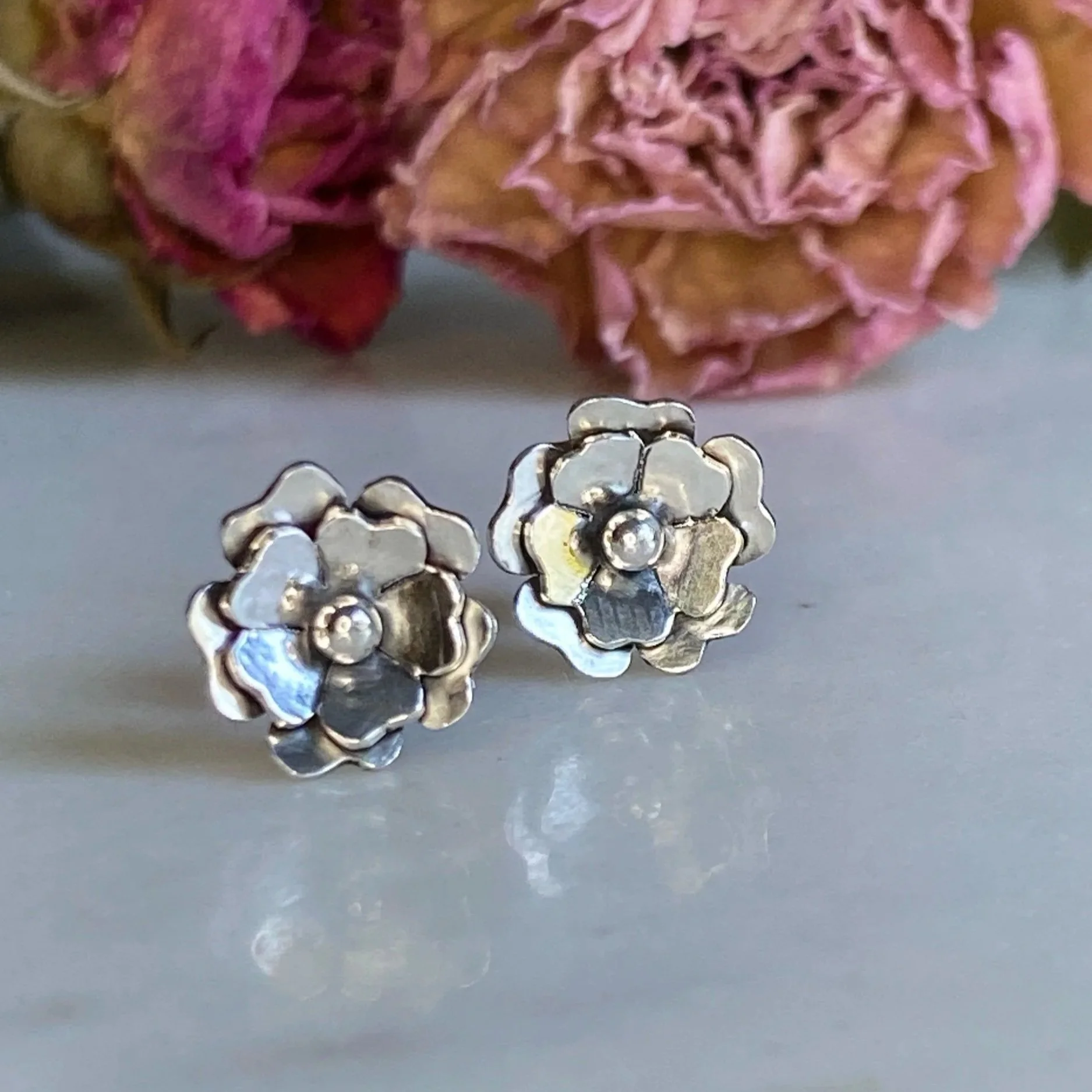 Handmade, sterling silver, flower, stud earrings. Handcrafted by Walter and Nancy Jewellery.